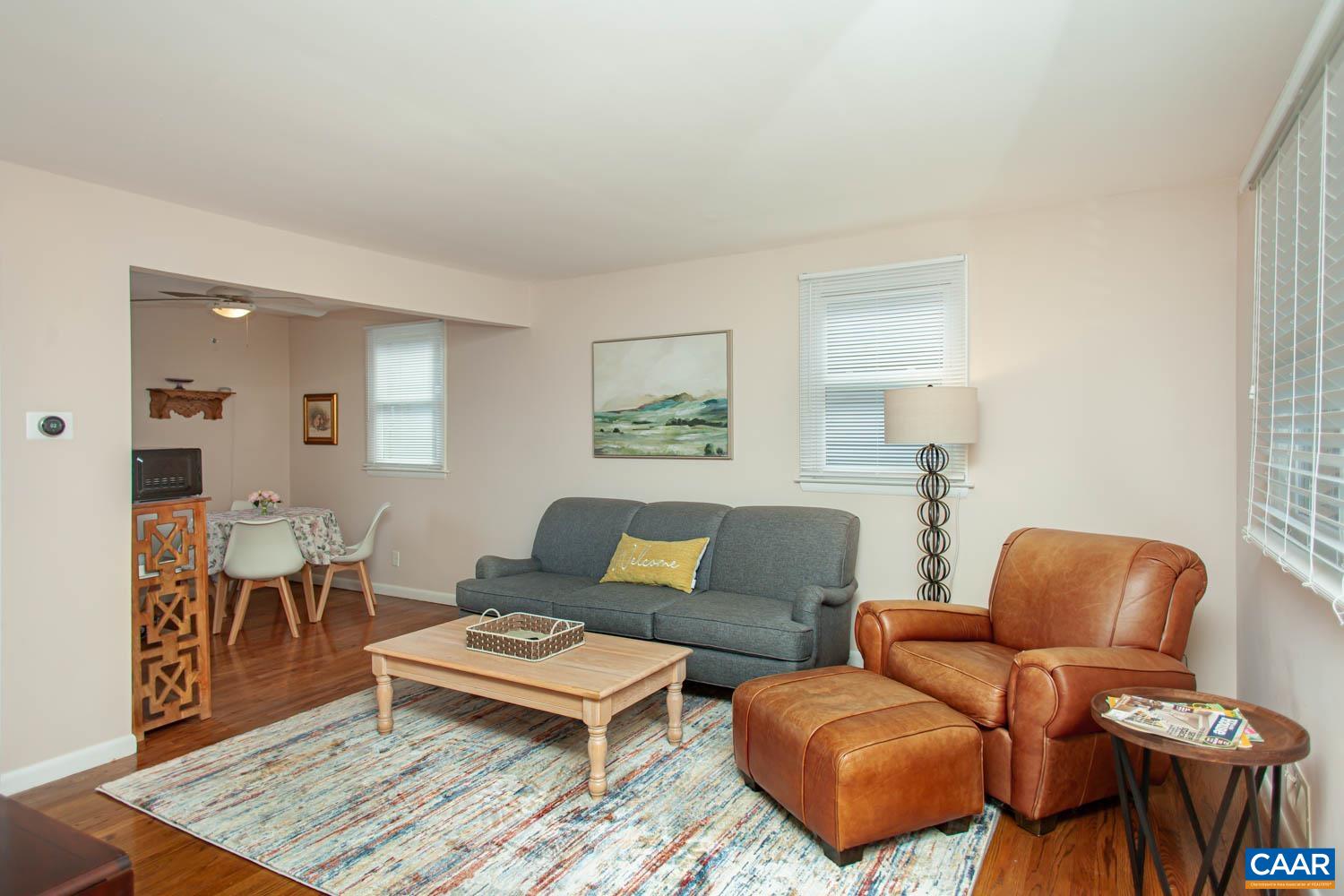 Living room leads to the breakfast nook off the kitchen.