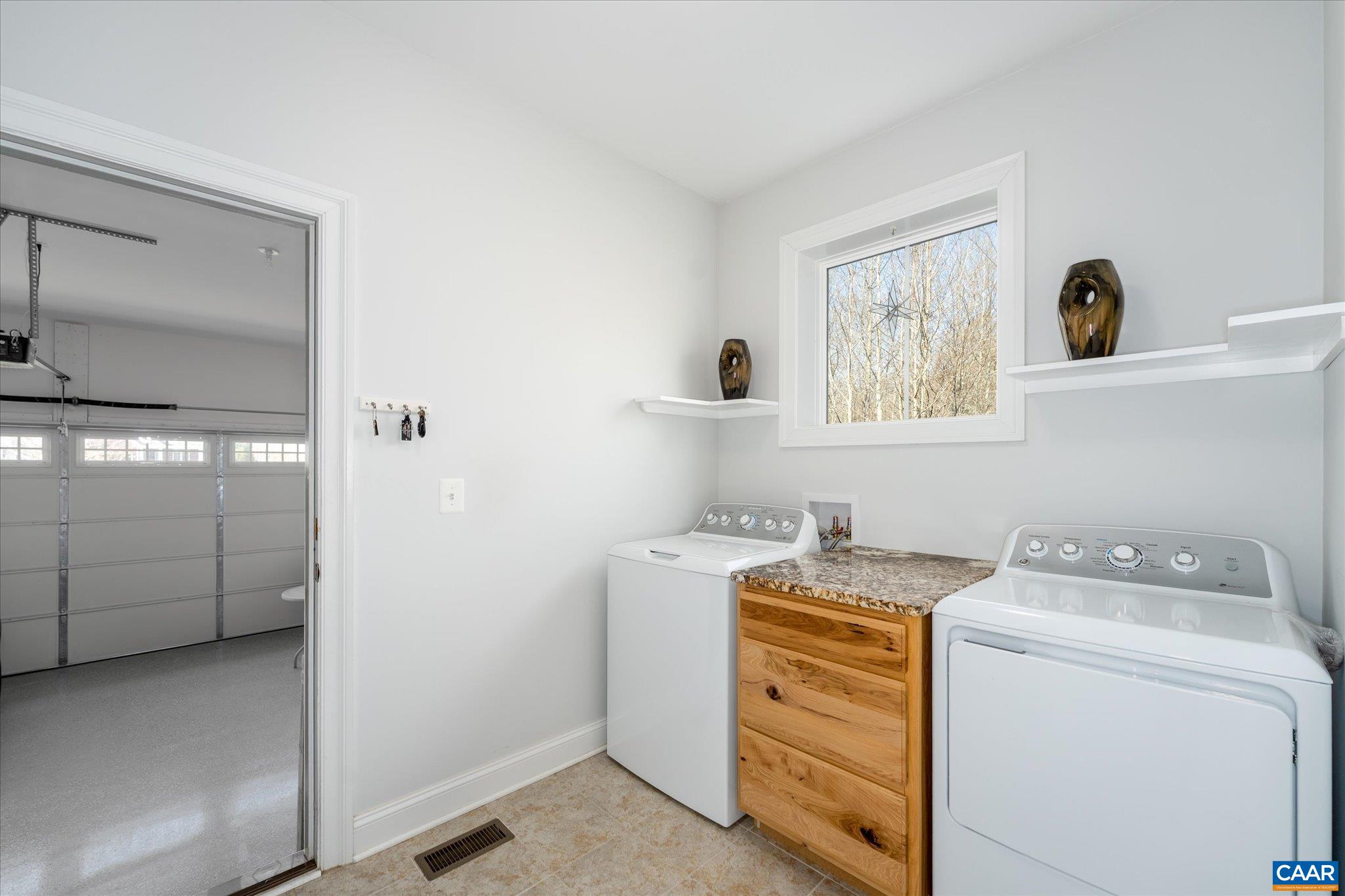 Laundry room with custom built in w/marble top