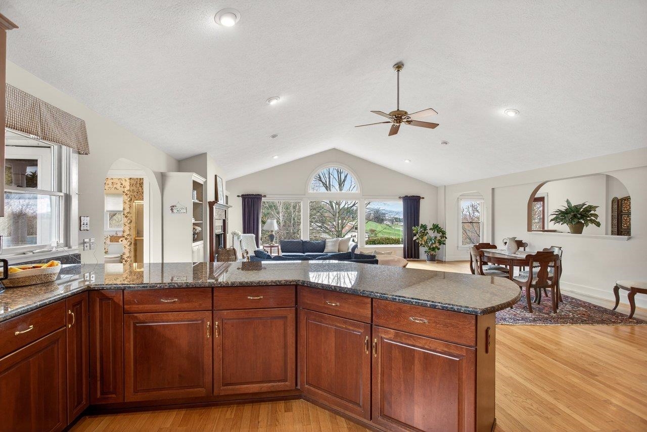 Grantite Counter tops, tile backsplash solid cherry cabinetry, and eating bar with room for eight. Cooking and entertaining are a perfect match here Grantite Counter tops, tile backsplash solid cherry cabinetry, and eating bar with room for eight. Cooking and entertaining are a perfect match here