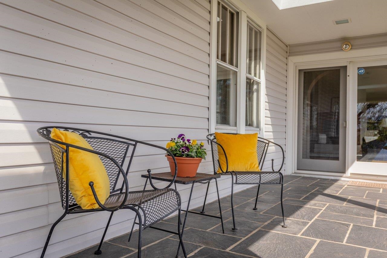 The front porch of the original farm house was extended to a wrap around porch where beautiful sunsets can be enjoyed outside The front porch of the original farm house was extended to a wrap around porch where beautiful sunsets can be enjoyed outside