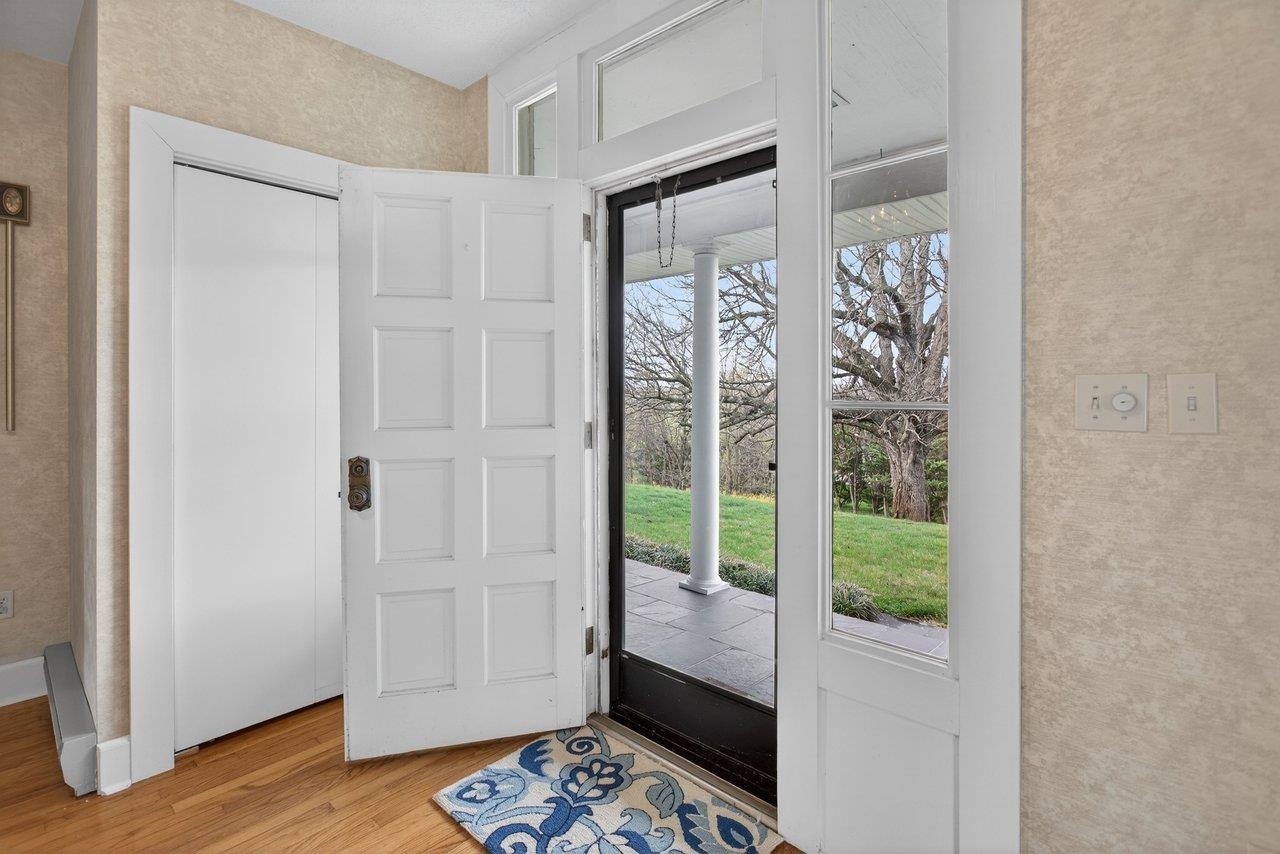 A new front door with additional side window panels is an update that adds natural light to the Foyer A new front door with additional side window panels is an update that adds natural light to the Foyer
