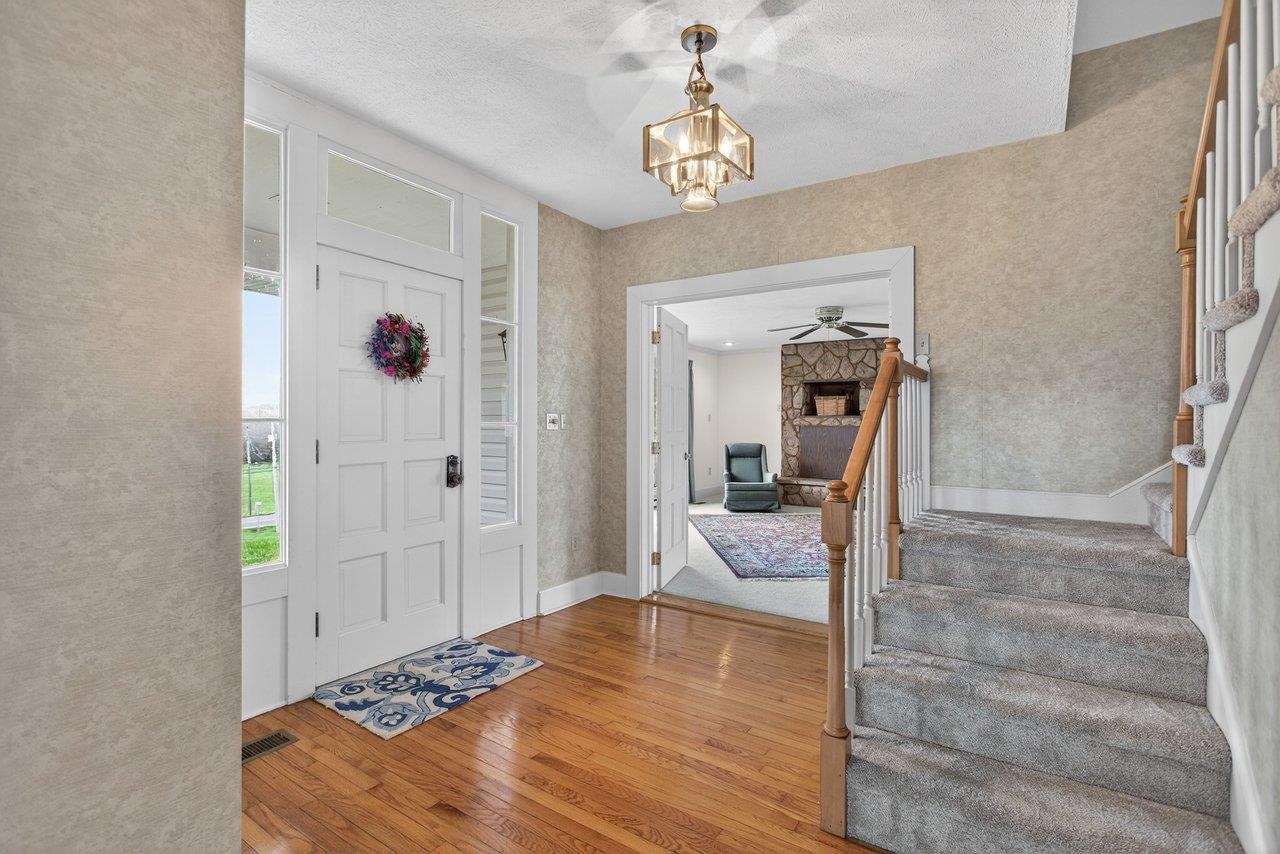The original hardwood is under the newly carpeted stairs leading to the upstairs bedrooms The original hardwood is under the newly carpeted stairs leading to the upstairs bedrooms