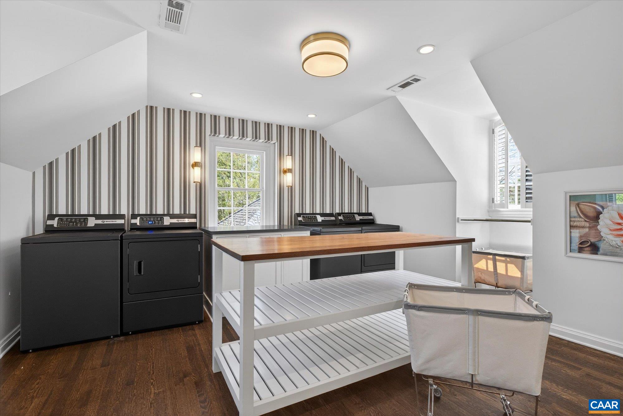 Owners converted the 5th bedroom to this sunny laundry room but it can easily be converted back to a bedroom.