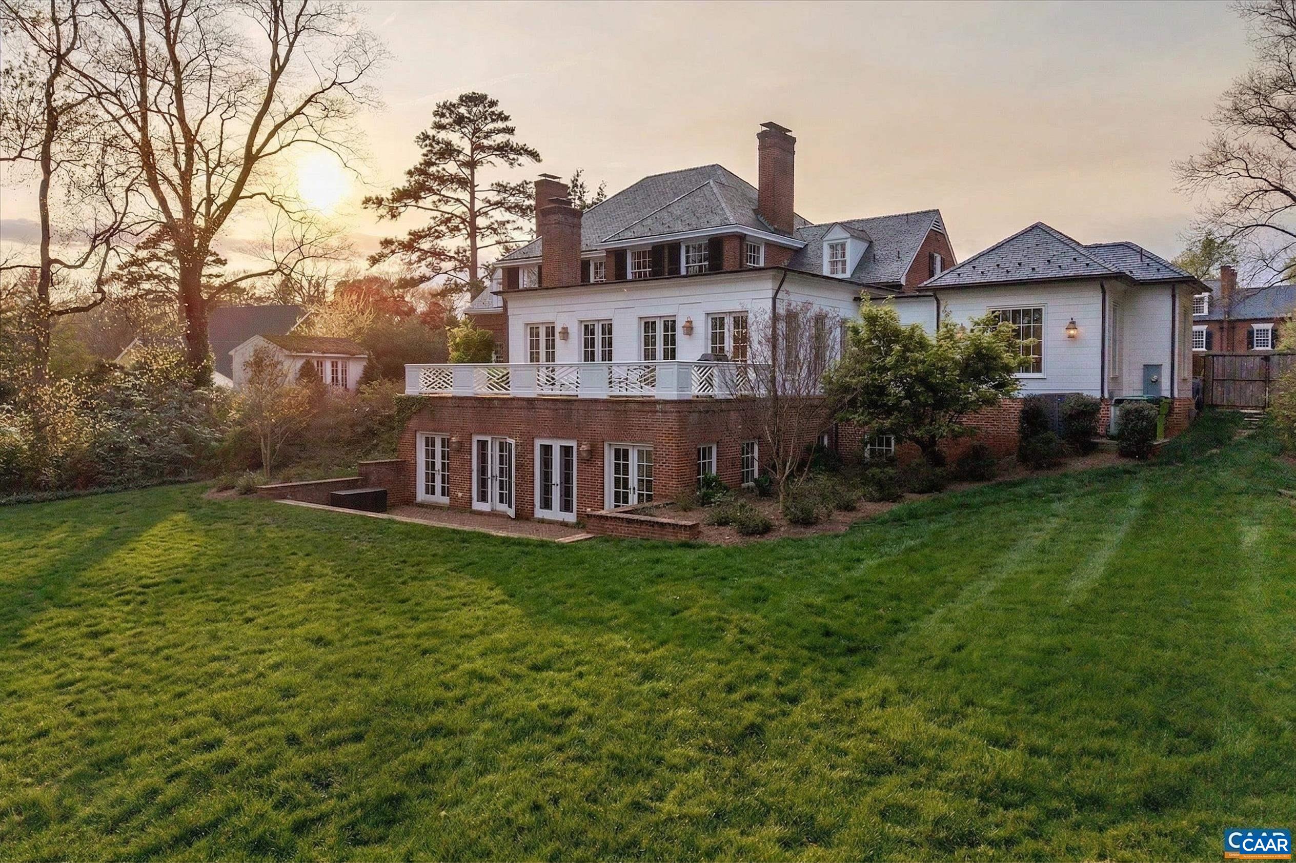 The 0.85 acre parcel includes this sweeping rear lawn bordered by azaleas and rhododendruns.