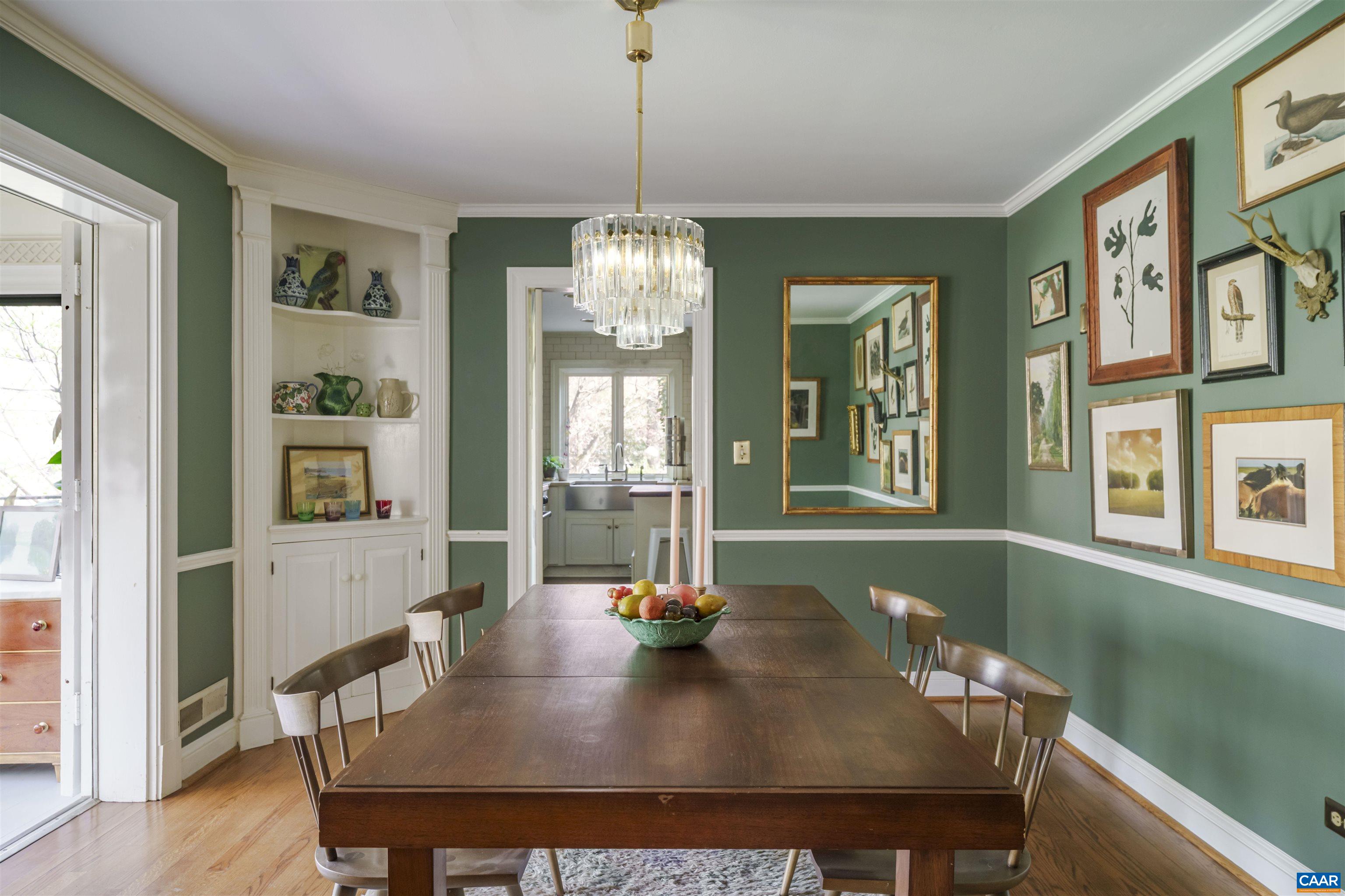 French doors open to sunroom from dining room