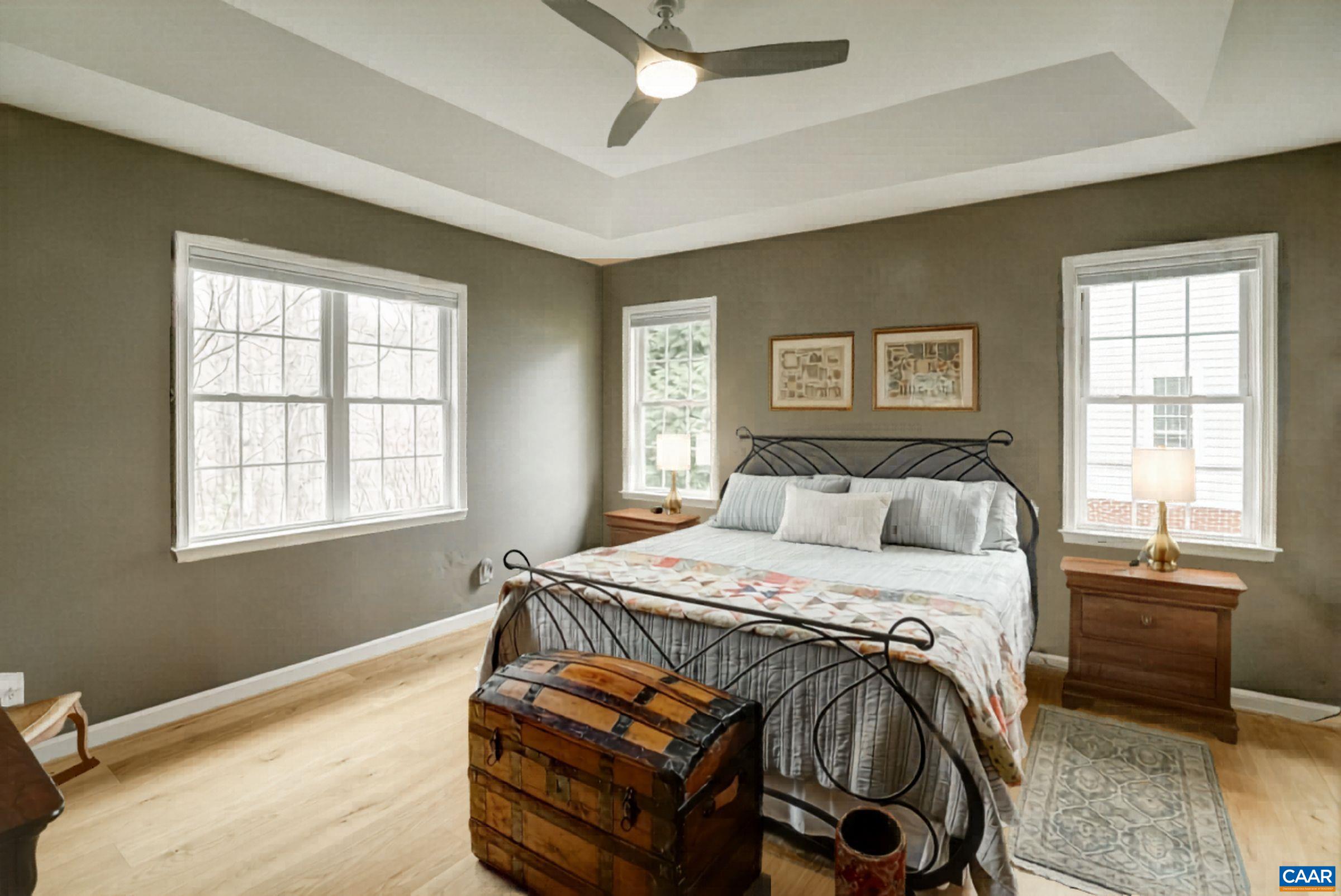 Age-in-place with a first floor primary suite featuring ensuite bathroom and two closets.