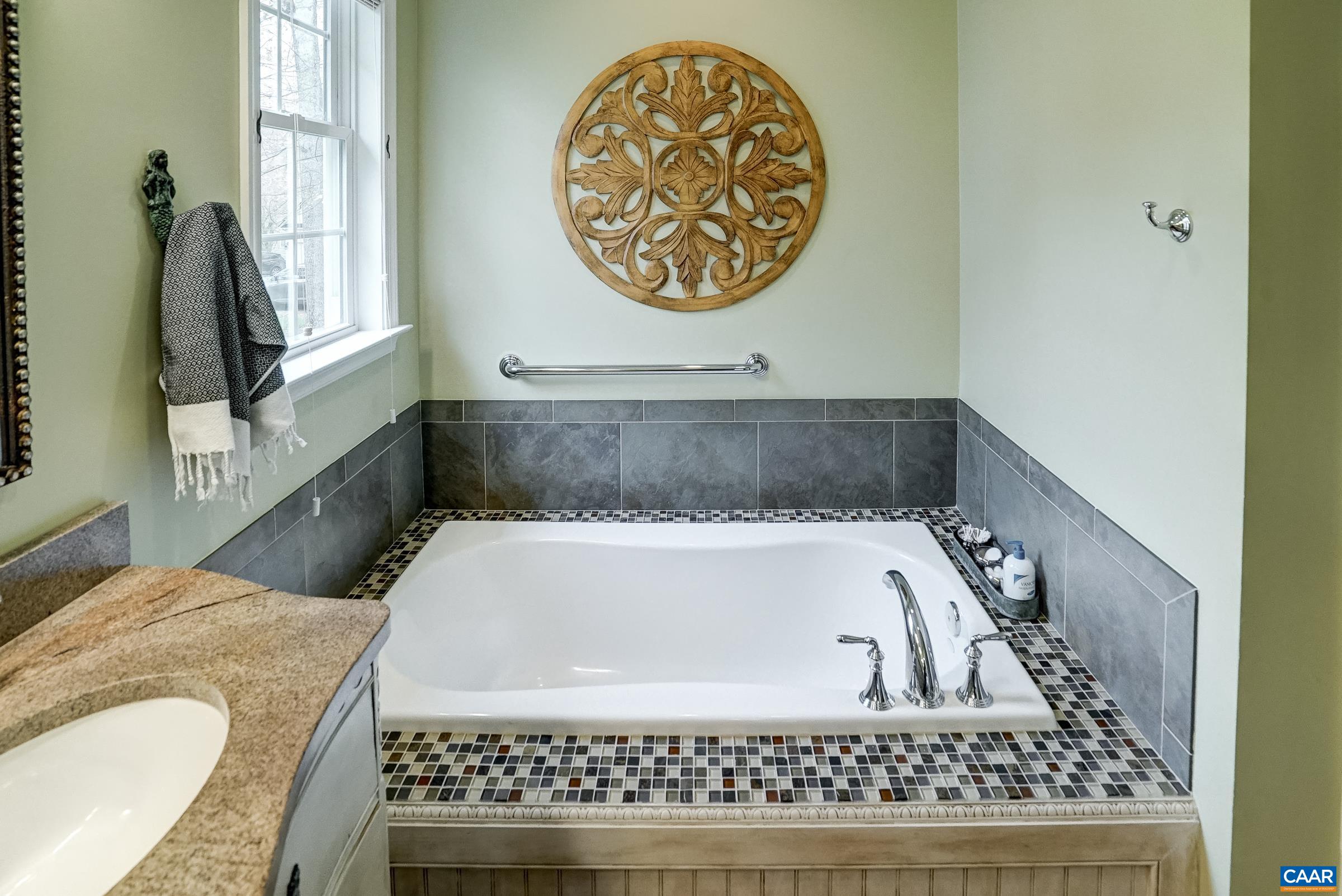 Soaking tub with beautiful tile surround.