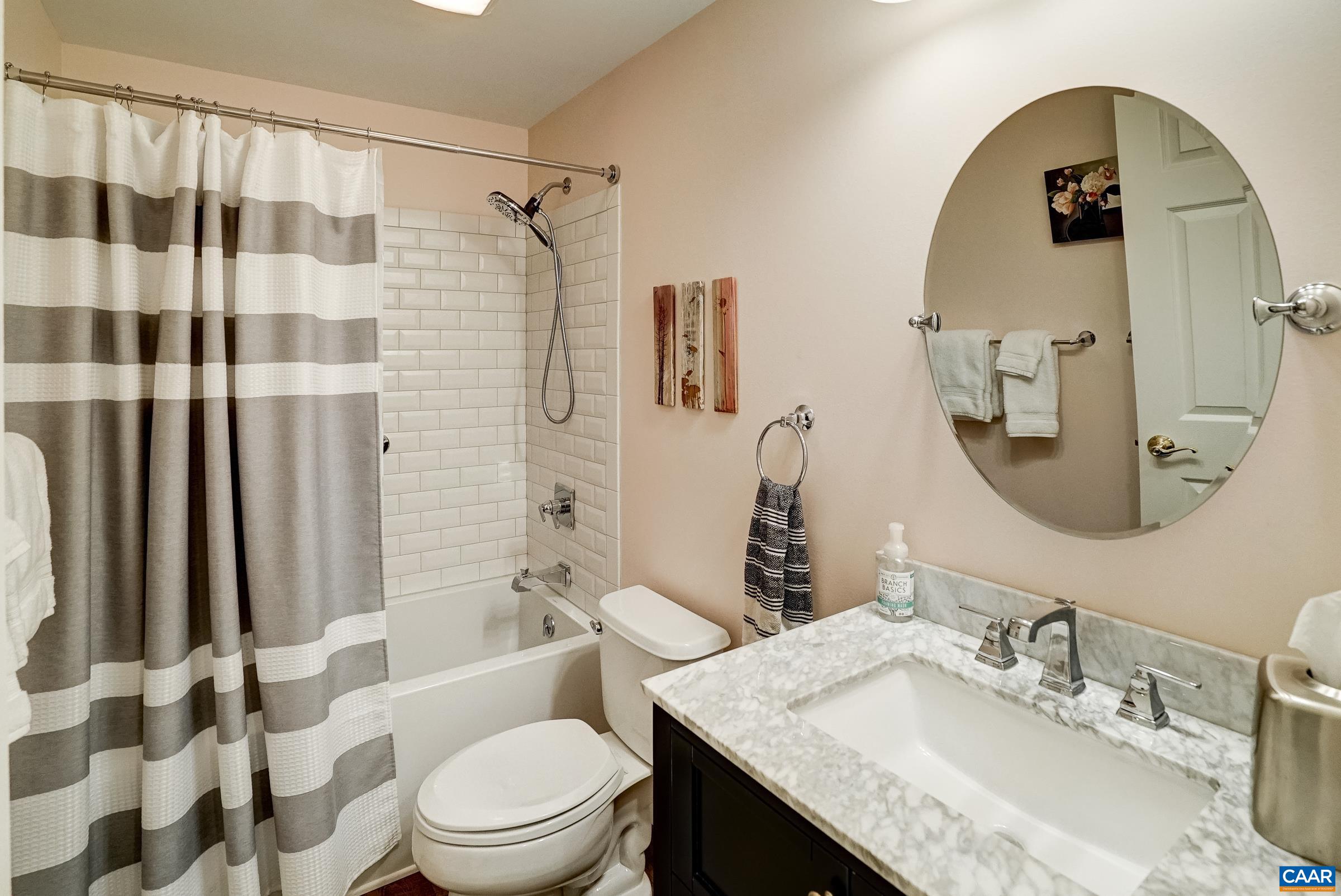 Full bathroom on lower level features a large soaking tub.