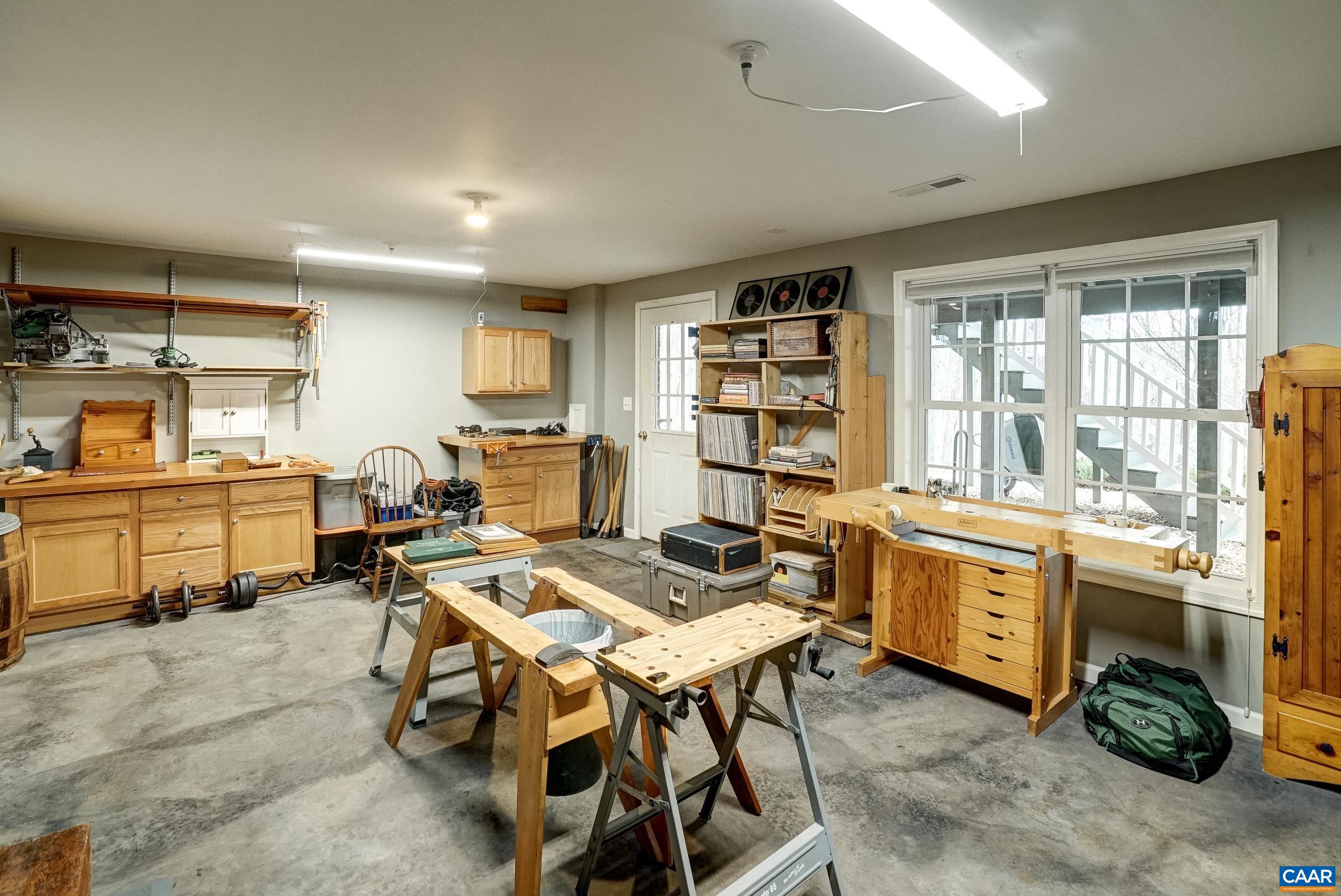 Incredible 300sqft workshop with mounted cabinetry is a wood-workers dream space!
