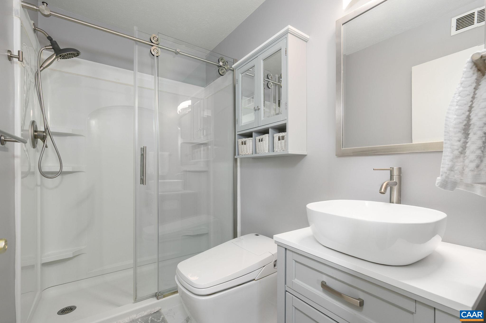 heavy glass doors, tile-surround shower. heavy glass doors, tile-surround shower.