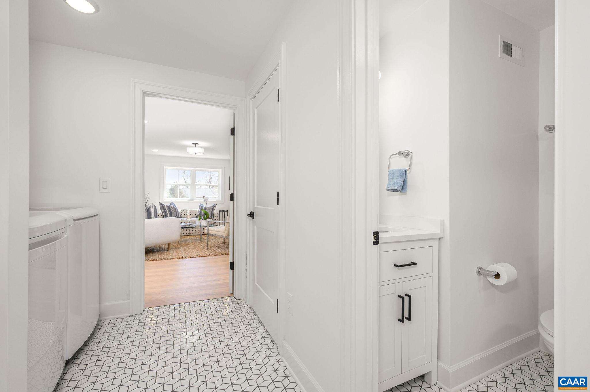 With partial interior view of downstairs full bath