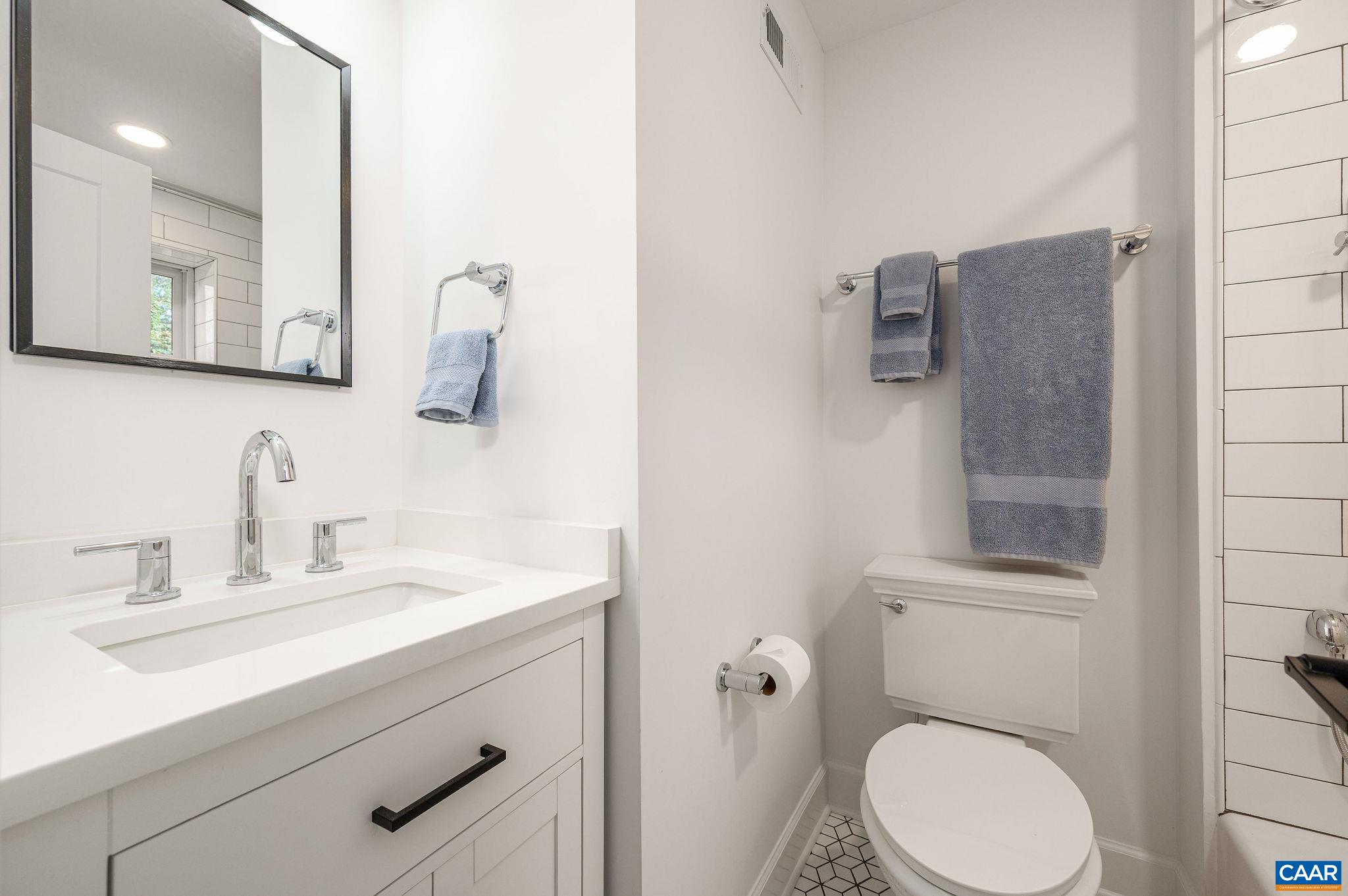 Shower/bathtub combo. Recessed medicine cabinet.