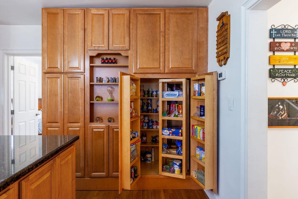 Large pantry provides excellent storage and organization space, keeping the kitchen functional and clutter-free.