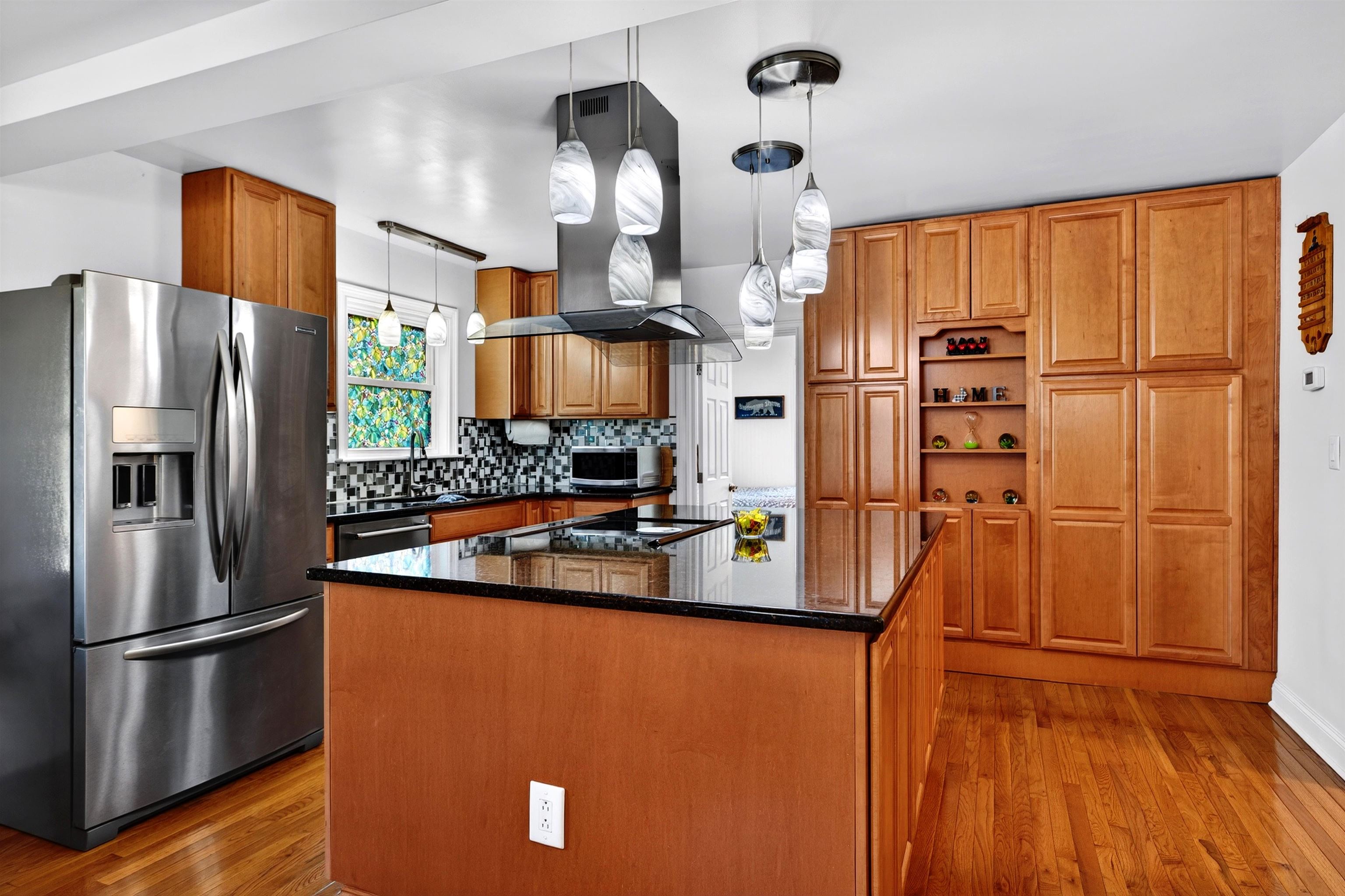 Updated kitchen with ample prep space, stainless steel appliances, and a functional layout designed for everyday cooking and gathering.