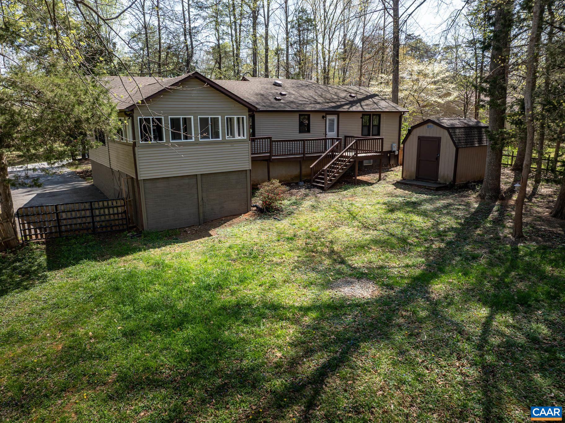 Lovely fenced yard. Large shed. Expansive deck. Great sunroom. Lovely fenced yard. Large shed. Expansive deck. Great sunroom.