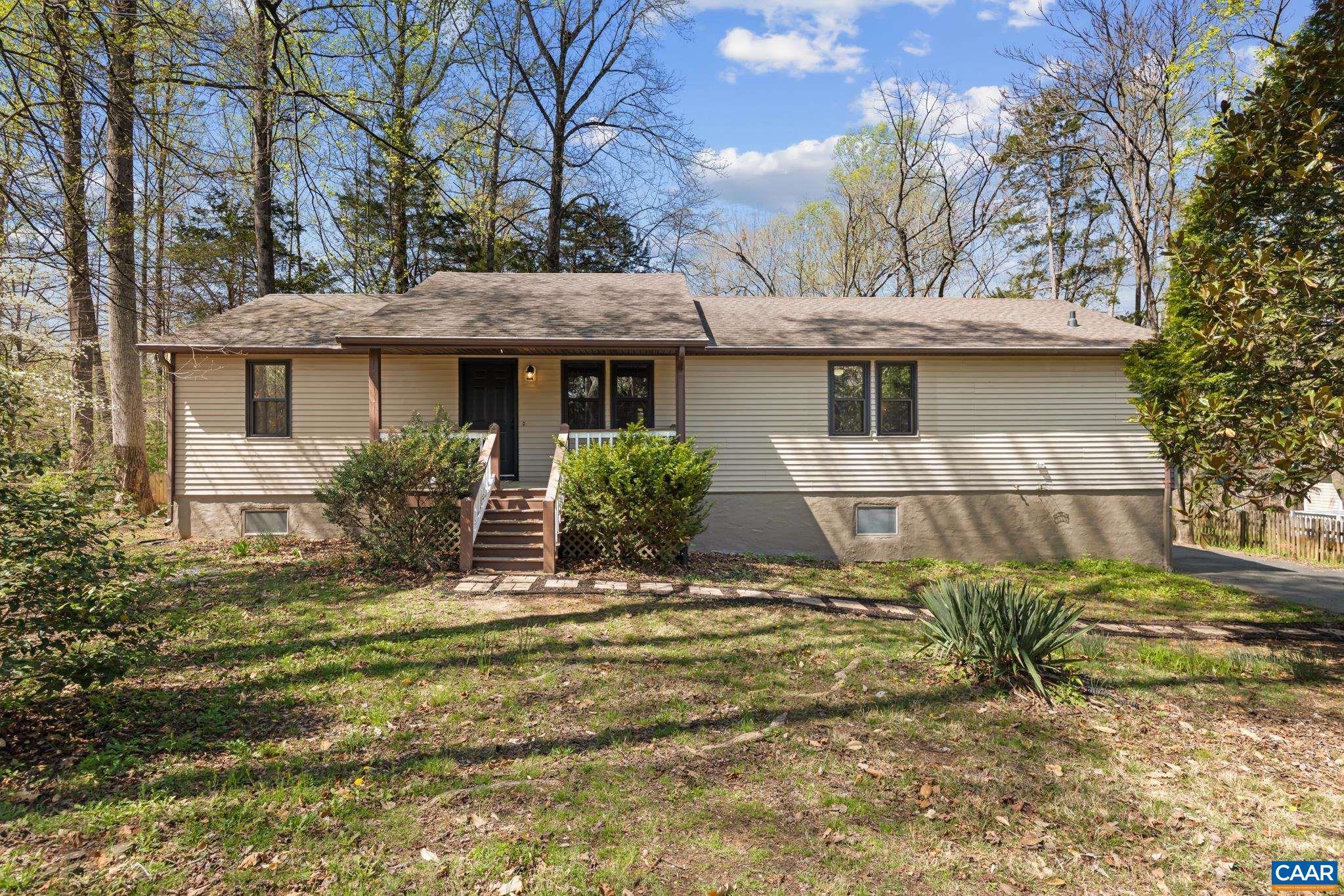 Escape to your wooded oasis! This charming single-story home offers a peaceful retreat with a cozy front porch and a lush, natural setting. Your perfect getaway awaits! Escape to your wooded oasis! This charming single-story home offers a peaceful retreat with a cozy front porch and a lush, natural setting. Your perfect getaway awaits!