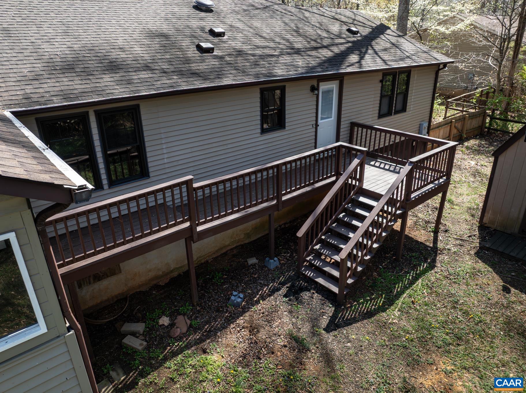 Enjoy outdoor living on the spacious, multi-level deck of this charming home, perfect for entertaining or relaxing in a private, wooded setting. Enjoy outdoor living on the spacious, multi-level deck of this charming home, perfect for entertaining or relaxing in a private, wooded setting.