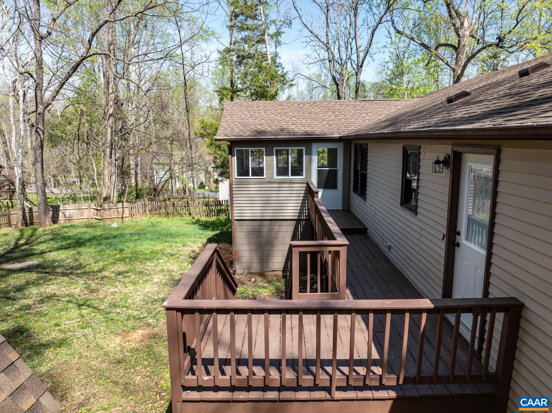 Enjoy outdoor living on the spacious deck, overlooking a lush, fenced backyard surrounded by mature trees. The home also features a sunroom—perfect for year-round relaxation! Enjoy outdoor living on the spacious deck, overlooking a lush, fenced backyard surrounded by mature trees. The home also features a sunroom—perfect for year-round relaxation!