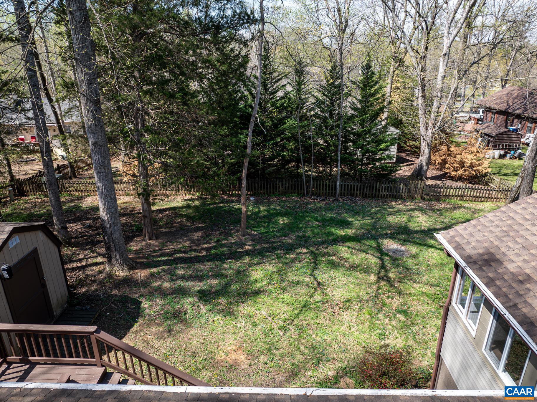 Enjoy the tranquility of nature from your spacious back deck, perfect for entertaining or relaxing. The large, private backyard with mature trees and a convenient storage shed offers endless possibilities for outdoor enjoyment. Enjoy the tranquility of nature from your spacious back deck, perfect for entertaining or relaxing. The large, private backyard with mature trees and a convenient storage shed offers endless possibilities for outdoor enjoyment.