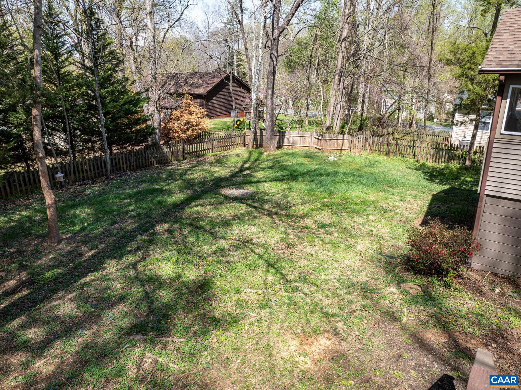 Enjoy your fenced, private backyard surrounded by mature trees. The spacious lawn offers room for relaxation and activities, with a natural, wooded setting for your family to enjoy. Enjoy your fenced, private backyard surrounded by mature trees. The spacious lawn offers room for relaxation and activities, with a natural, wooded setting for your family to enjoy.