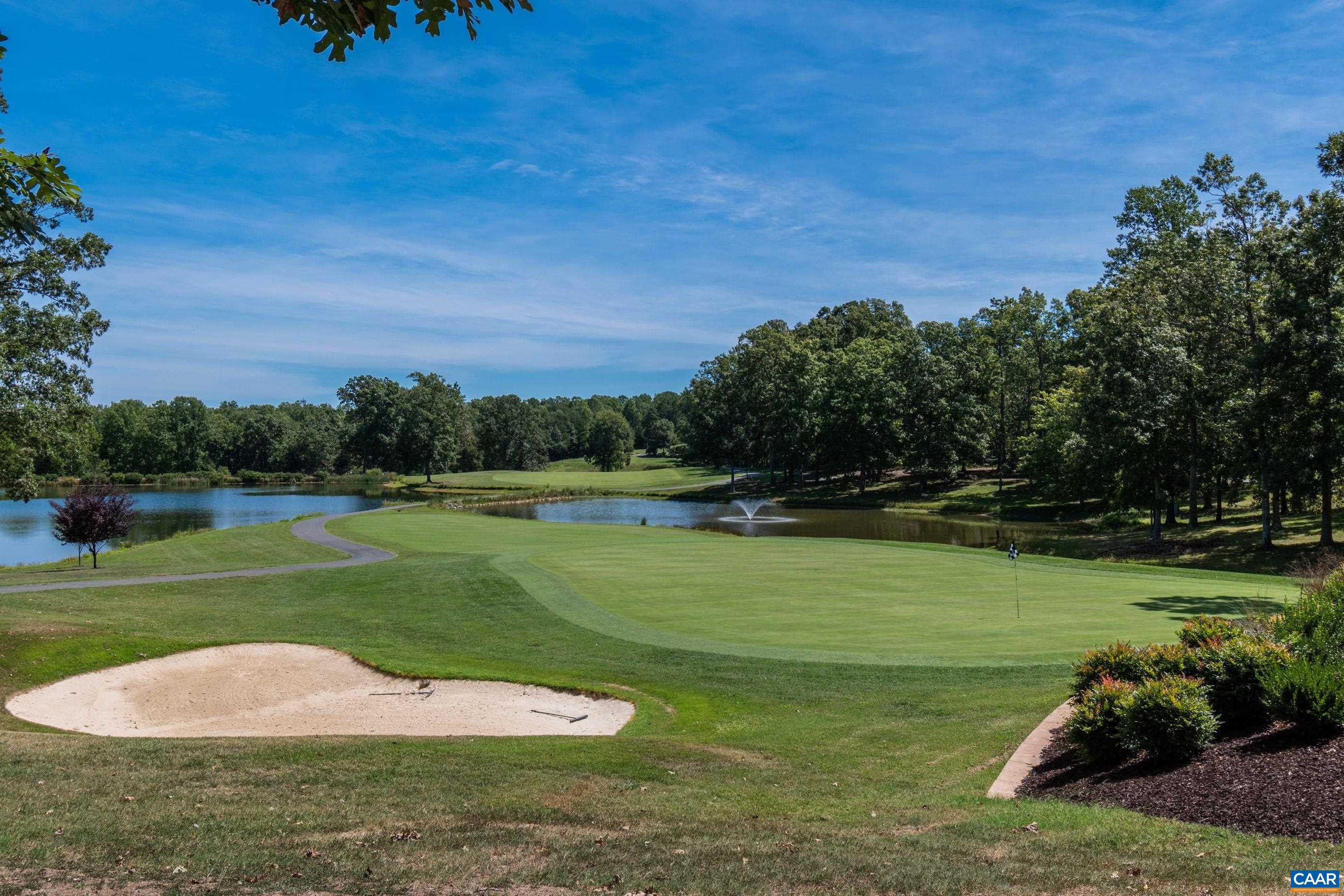 Escape to the serene greens and sparkling waters. Tee off on a perfectly manicured course, surrounded by lush trees and a tranquil pond with a fountain. Your perfect day on the links awaits! Escape to the serene greens and sparkling waters. Tee off on a perfectly manicured course, surrounded by lush trees and a tranquil pond with a fountain. Your perfect day on the links awaits!