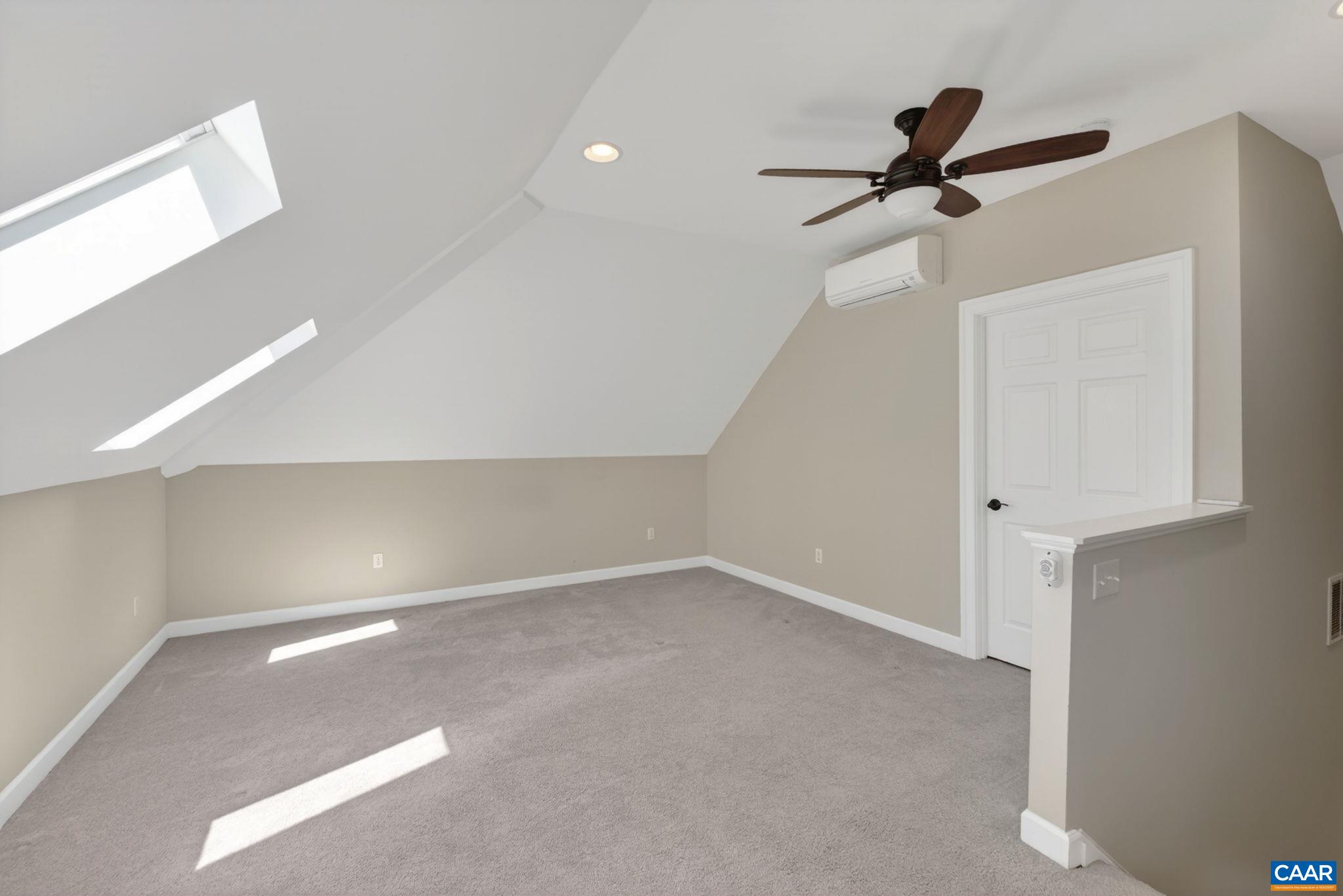 Huge room with 3 skylights could serve as guest or in-law quarters, bedroom suite, exercise room, home office etc. LARGE sunny flexible space.