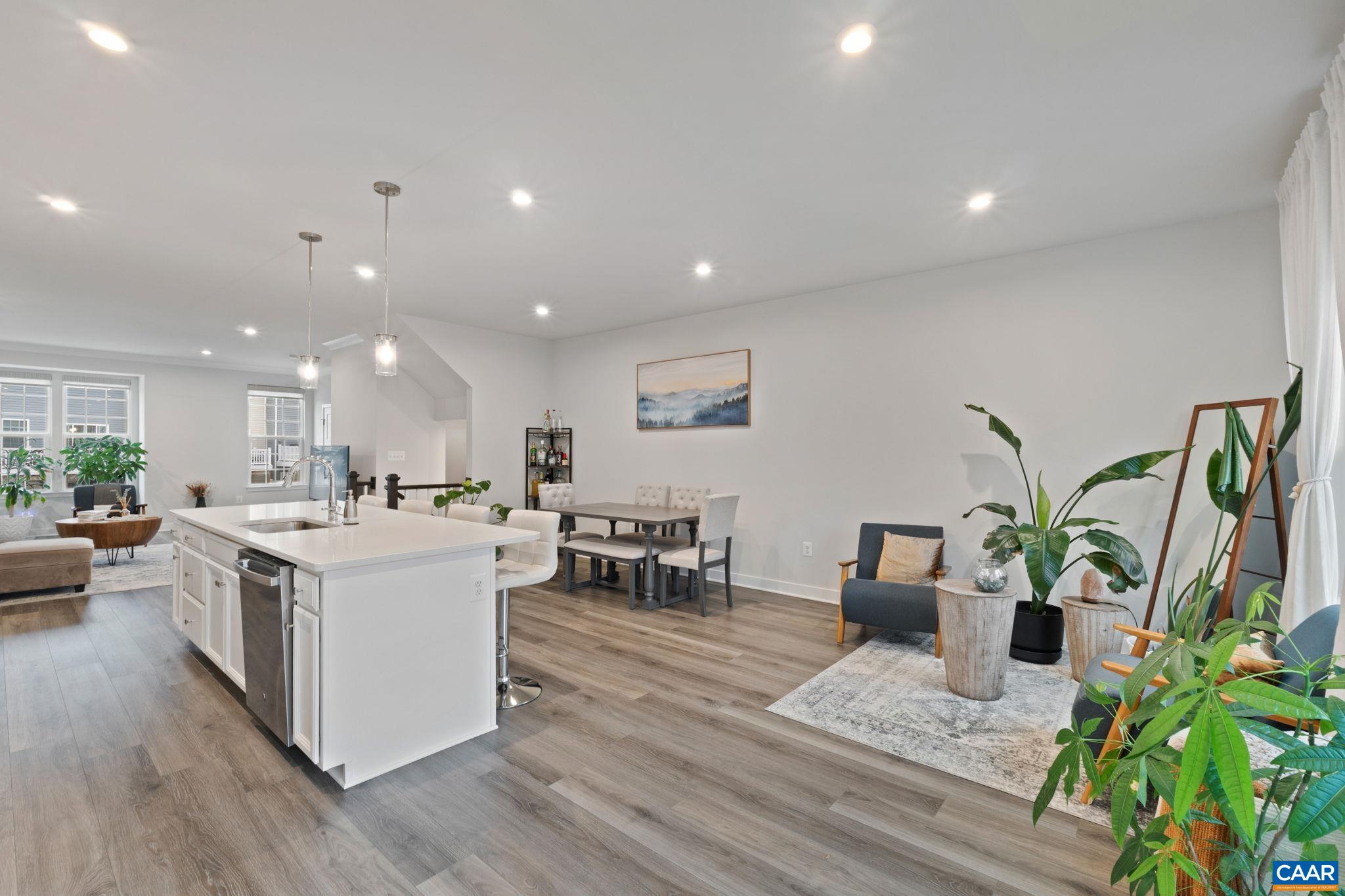 Expansive open-concept main level featuring seamless flow between kitchen, dining, and living areas—perfect for entertaining and everyday living. Expansive open-concept main level featuring seamless flow between kitchen, dining, and living areas—perfect for entertaining and everyday living.