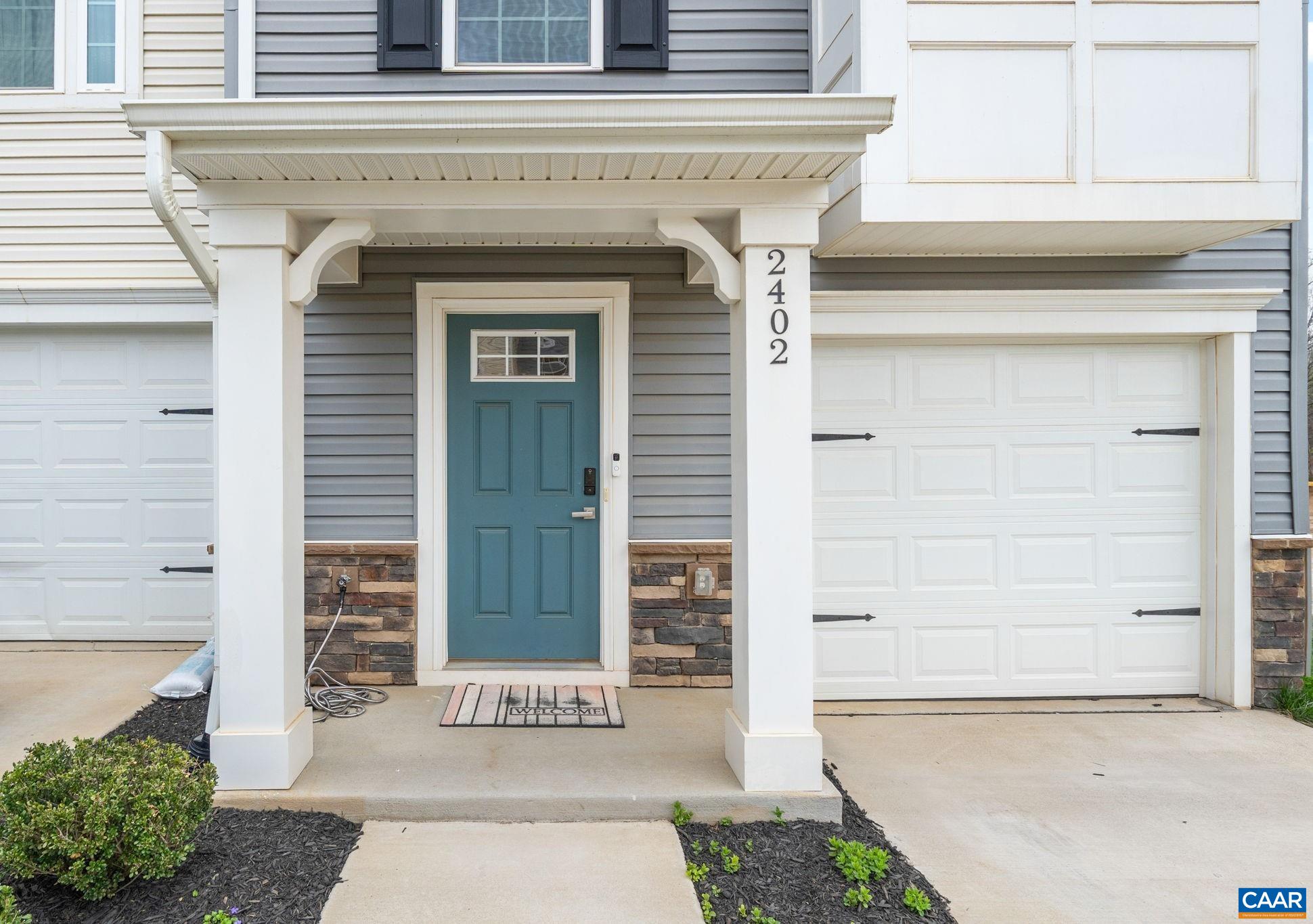 Inviting covered front entry with stylish architectural details and a warm, welcoming feel. Inviting covered front entry with stylish architectural details and a warm, welcoming feel.