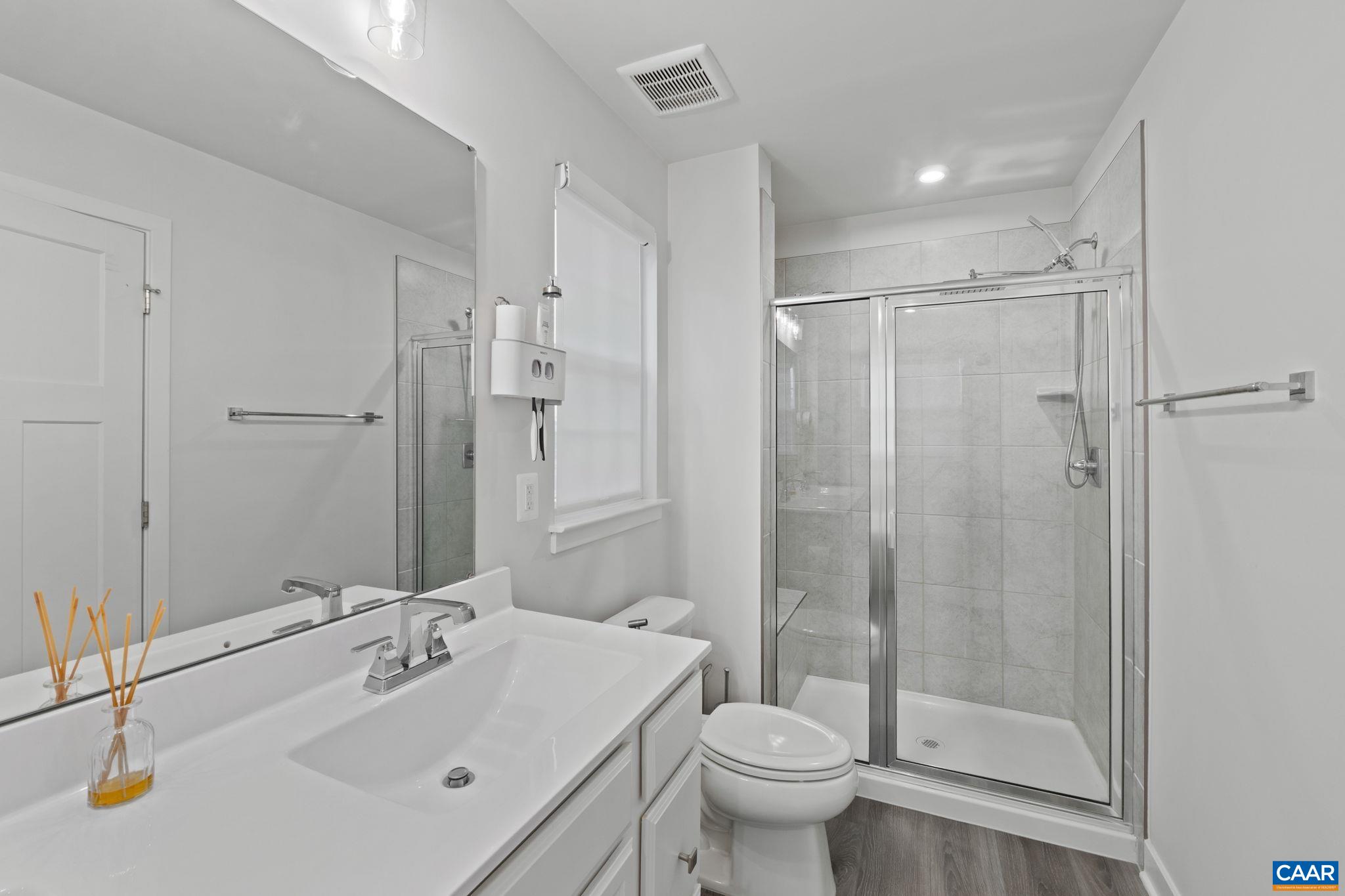Spacious primary bathroom featuring dual vanities, soaking tub, and separate glass-enclosed shower—designed for comfort and everyday functionality. Spacious primary bathroom featuring dual vanities, soaking tub, and separate glass-enclosed shower—designed for comfort and everyday functionality.