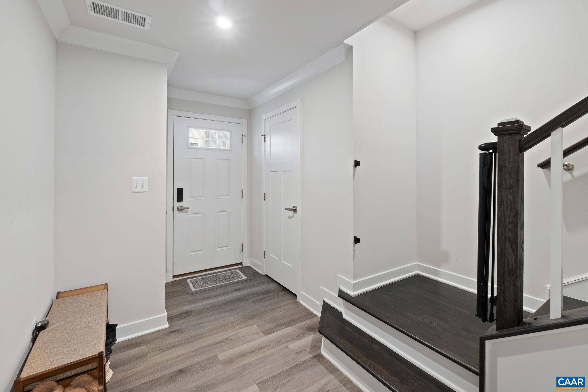 Bright entry foyer with direct access from front door, featuring durable flooring and convenient layout connecting to stairs and main living areas. Bright entry foyer with direct access from front door, featuring durable flooring and convenient layout connecting to stairs and main living areas.