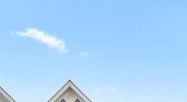 Stunning end-unit townhome featuring modern design, abundant natural light, and standout curb appeal in a growing community.