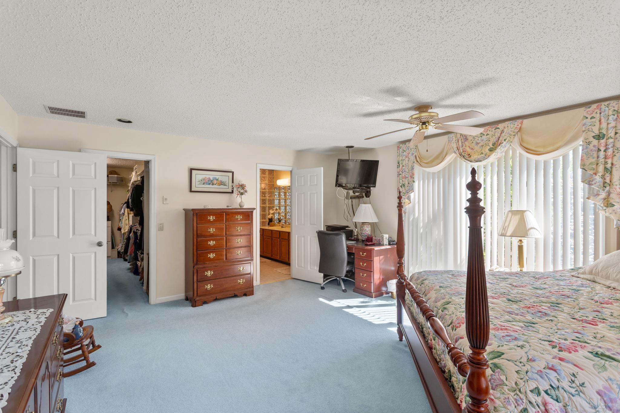 with walk-in closet and large bathroom.