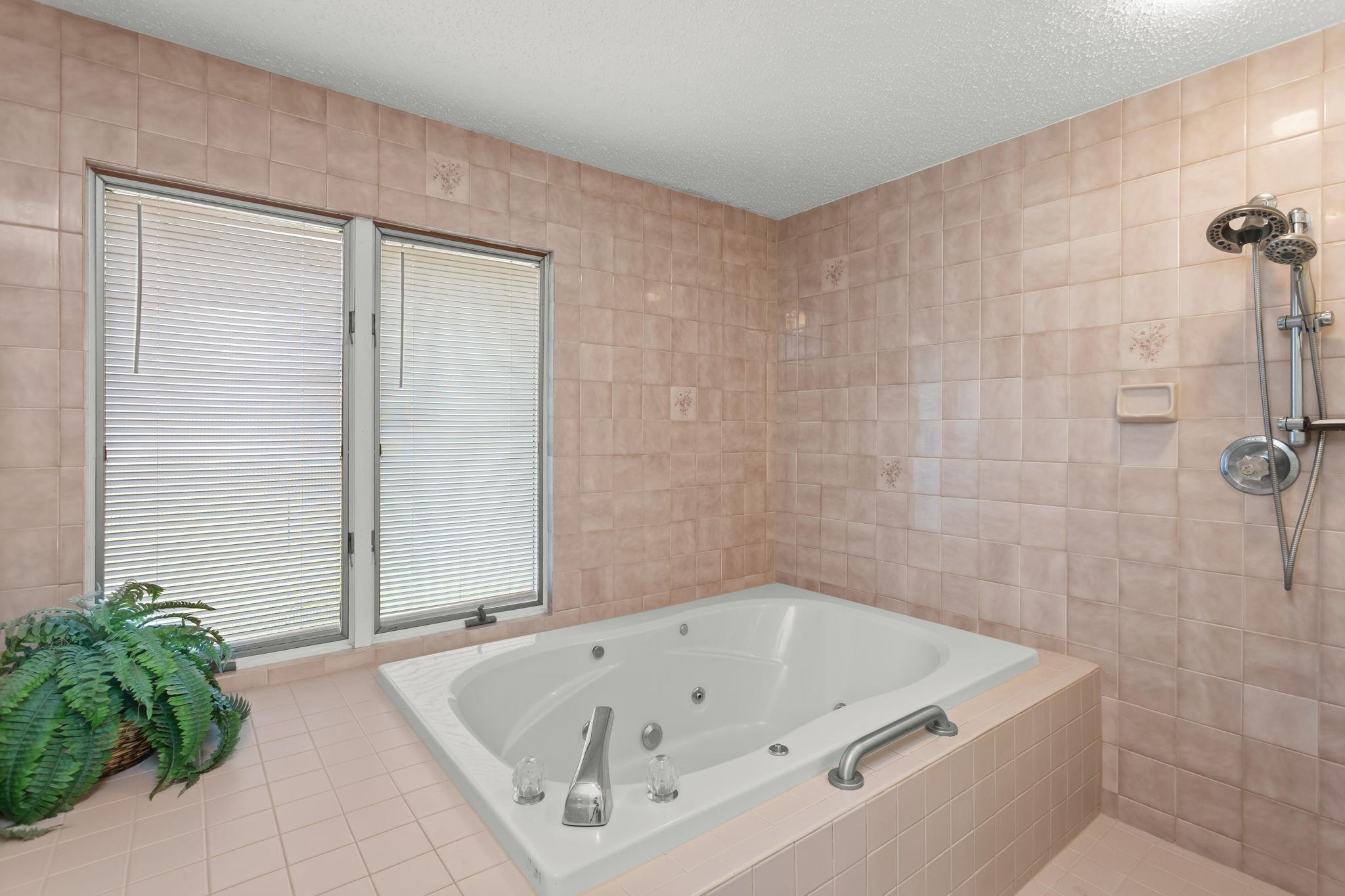 with jet tub and tile shower, all in one area!