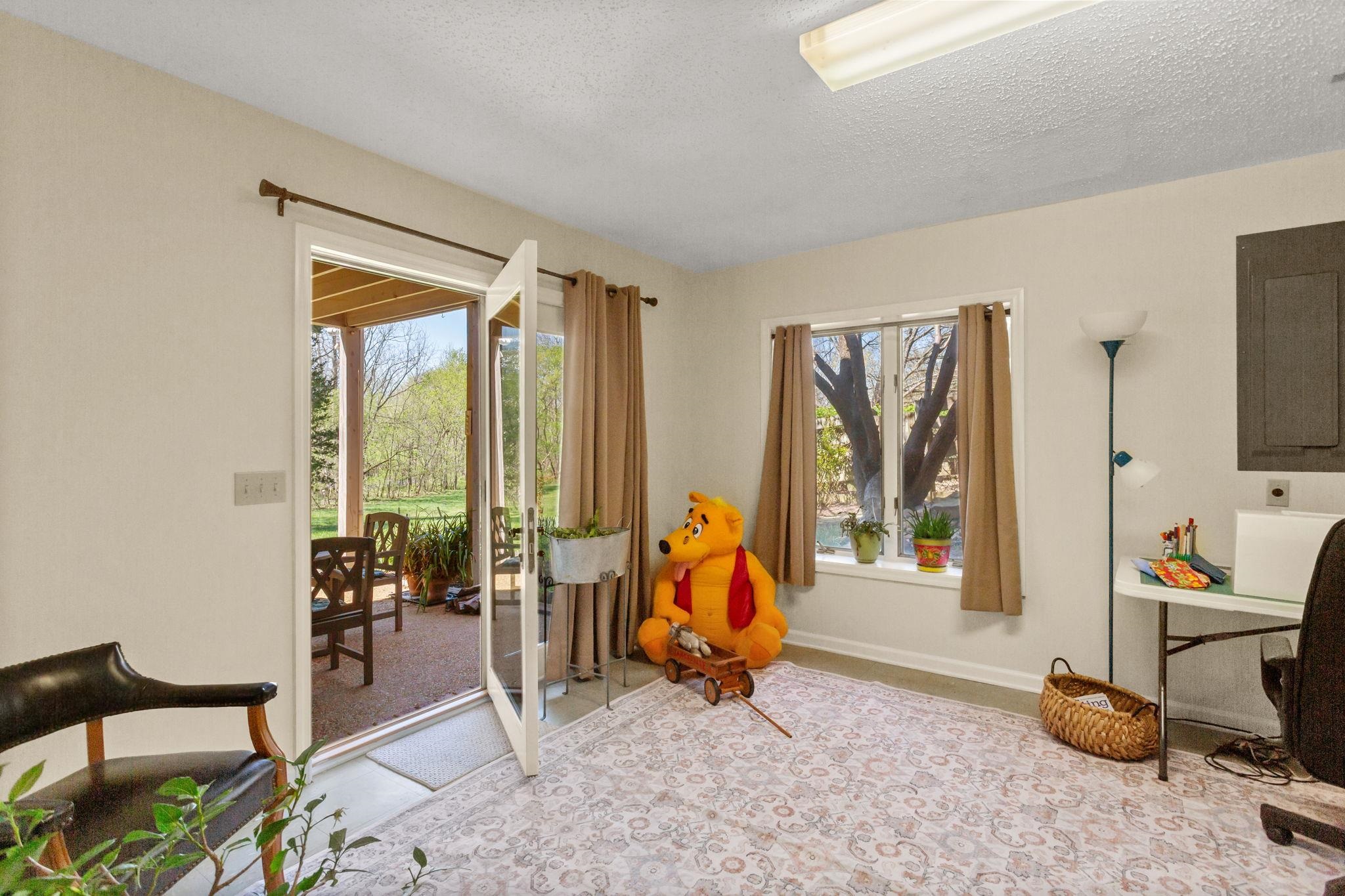 to covered terrace off the family room with access to the pool and terrace.