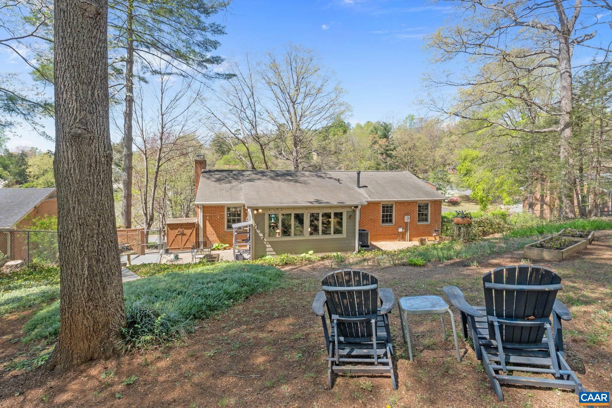 The large rear yard is fully fenced, perfect for kids or dogs!