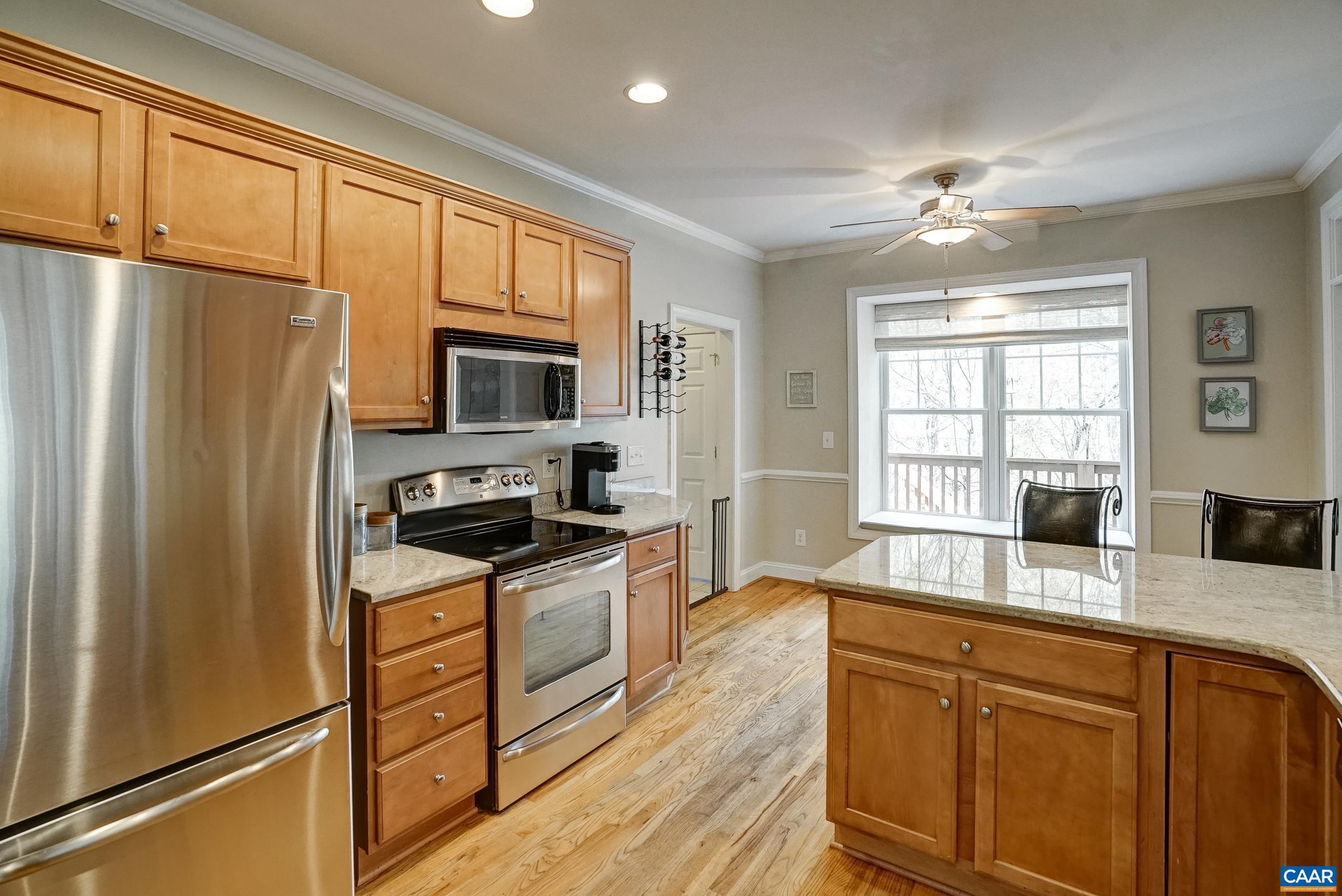Large bay window with bench seat could be an eat-in breakfast nook.