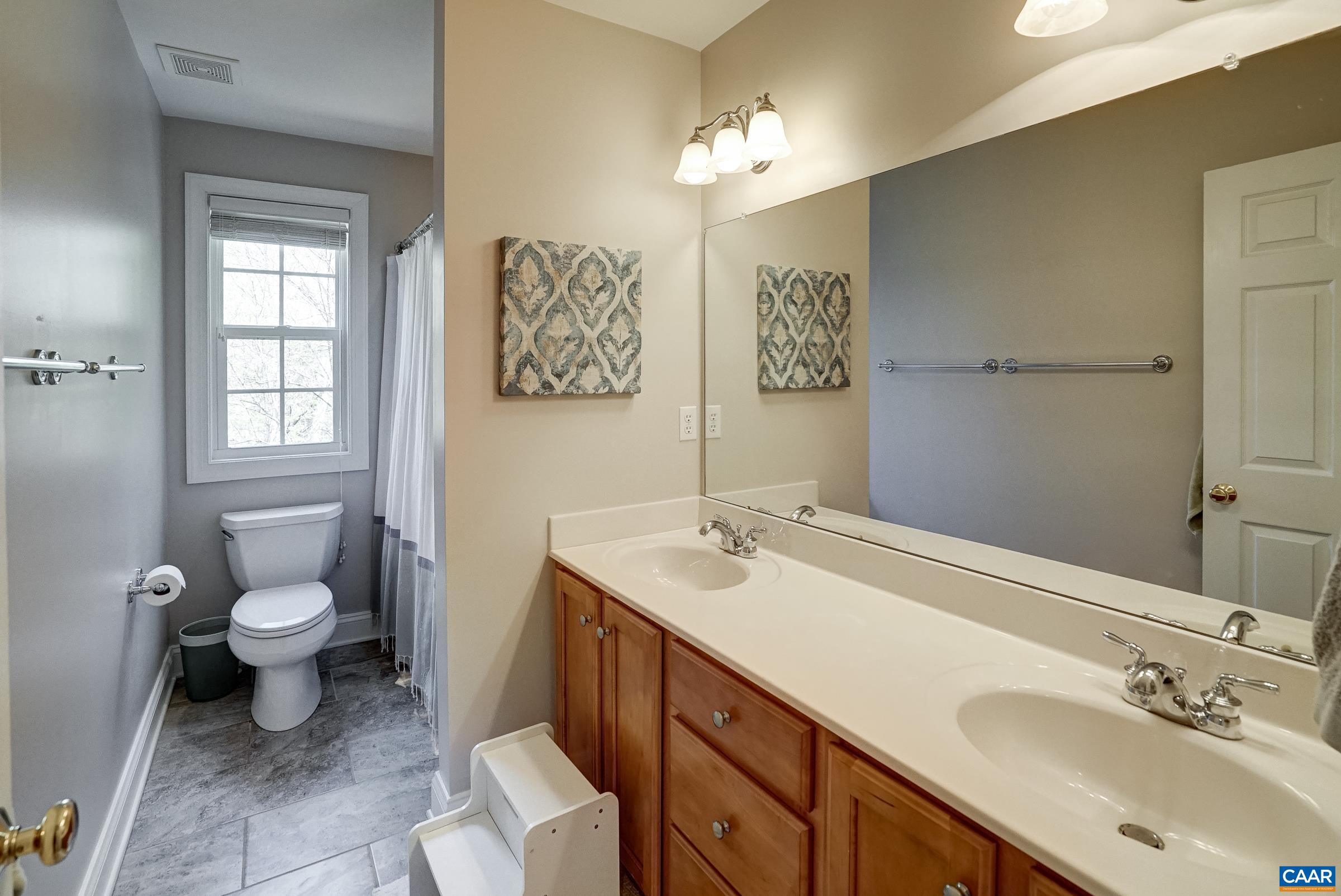 Hall bathroom with double sink vanity