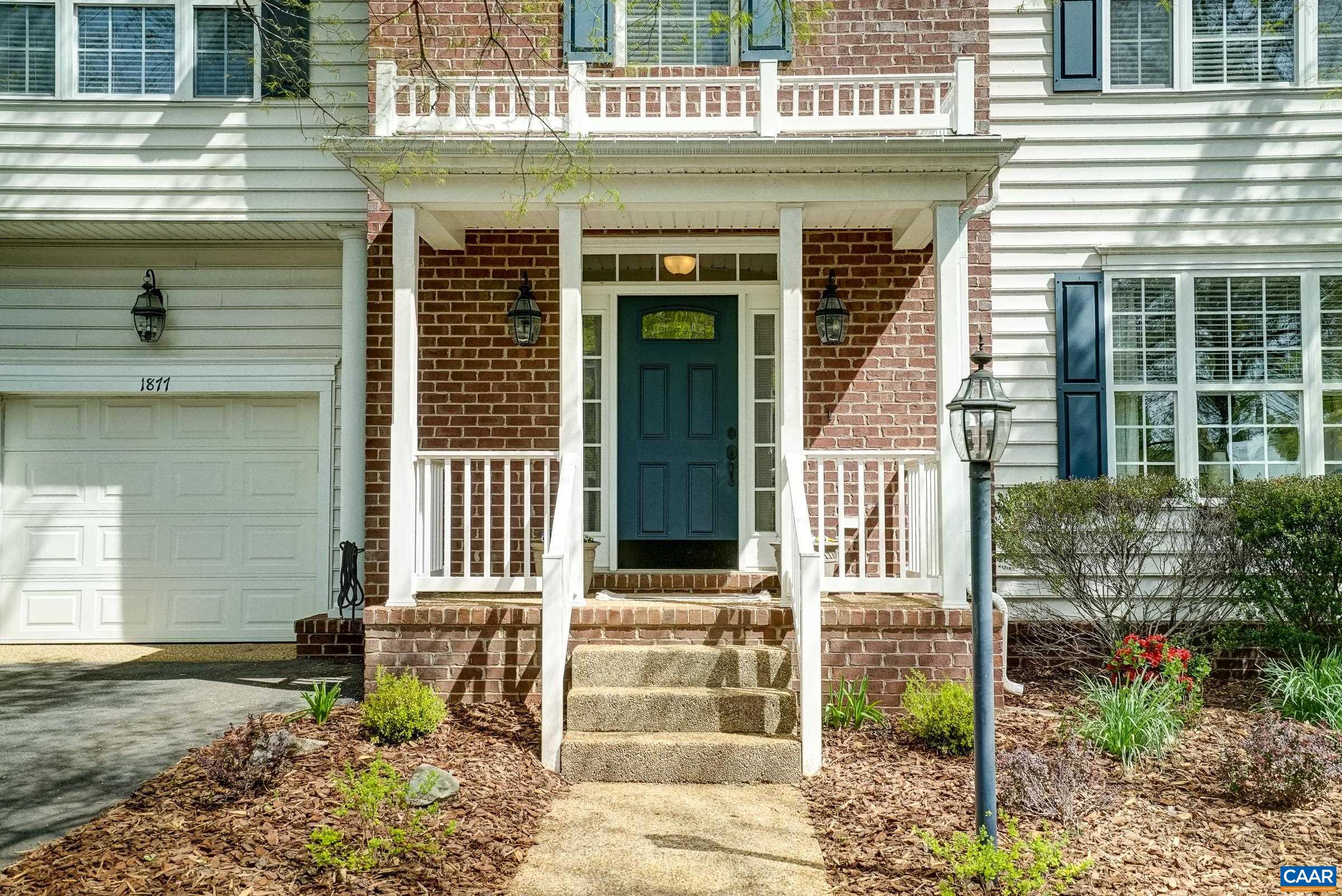 Brick covered front porch welcomes you in.