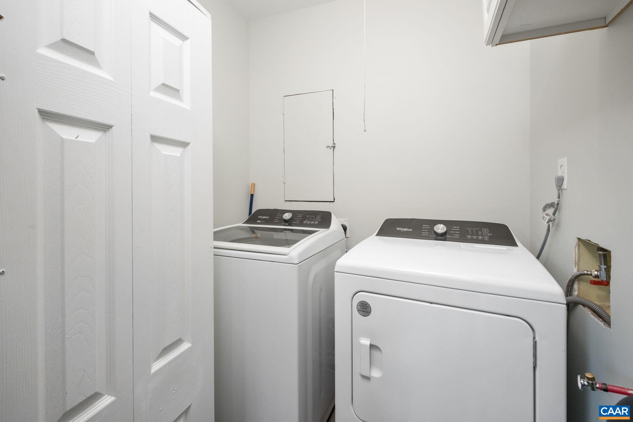Main level laundry area with sliding barn doors.
