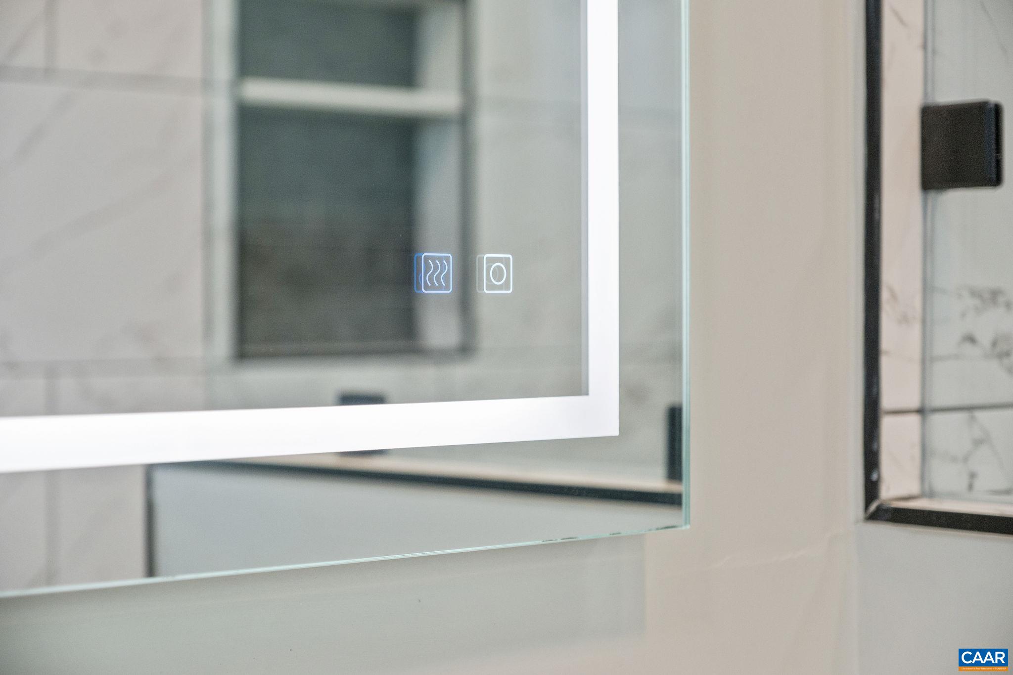 Lighted mirror in primary bathroom
