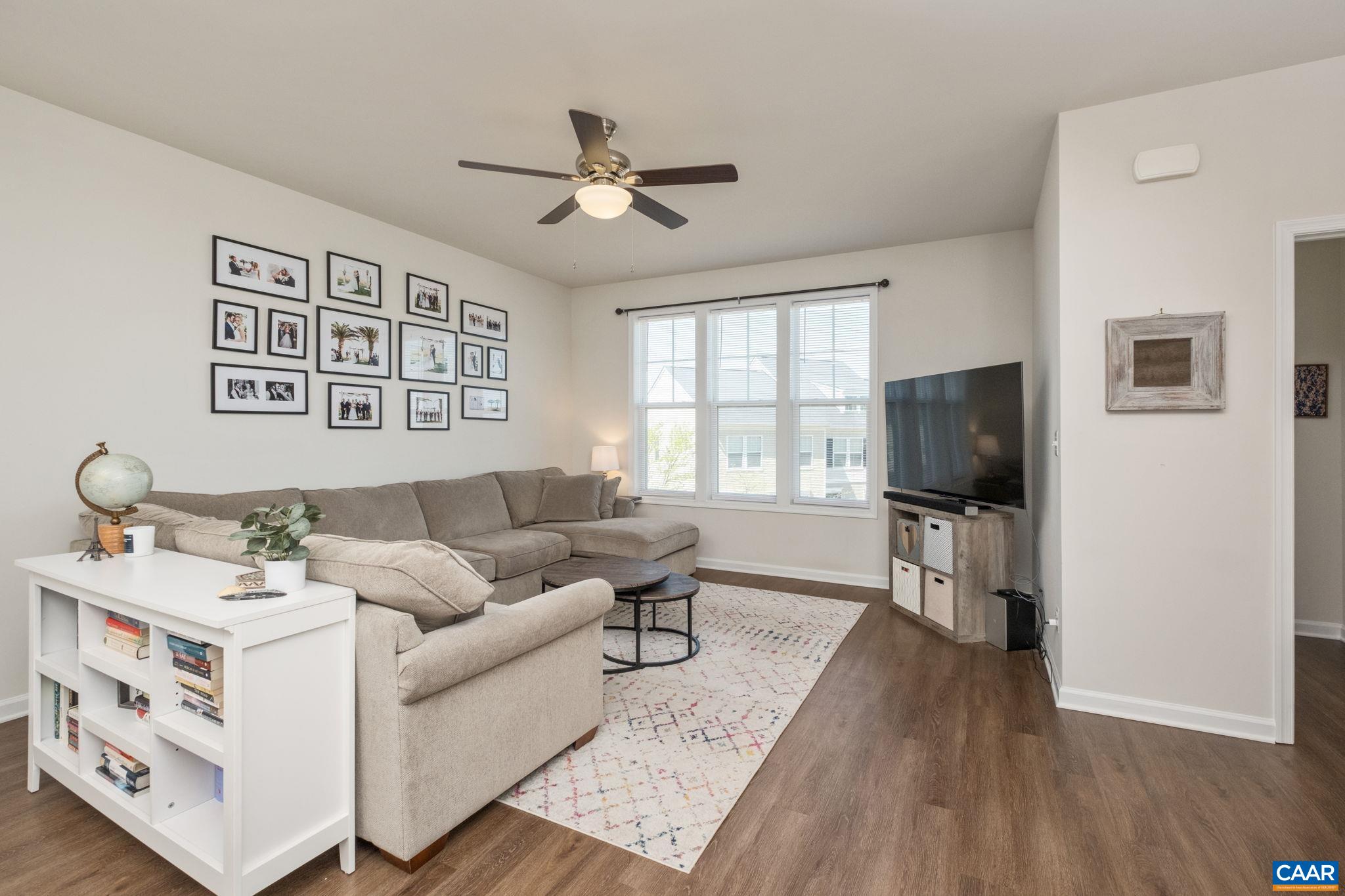 Living room features ceiling fan.