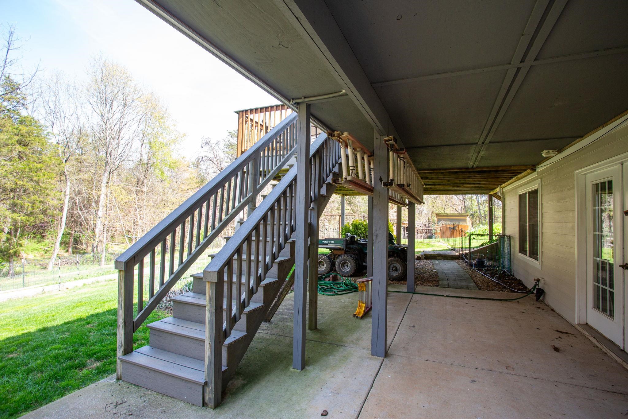 under the upper deck and sunroom.