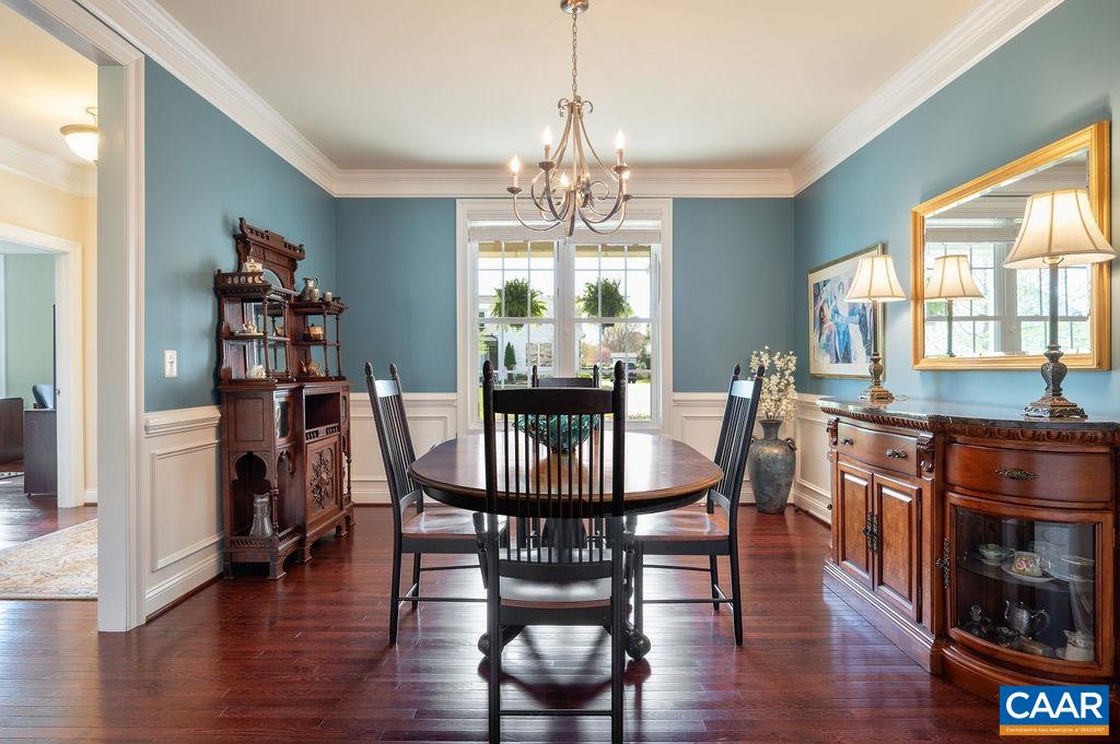 Beautiful hardwood floors and wainscoting in the dining room