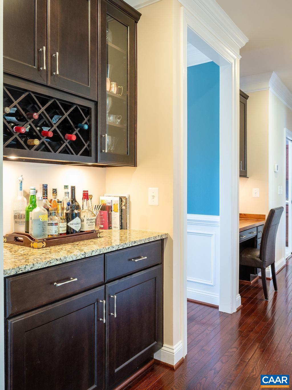 Bar area and desk cubby in hall behind dining room