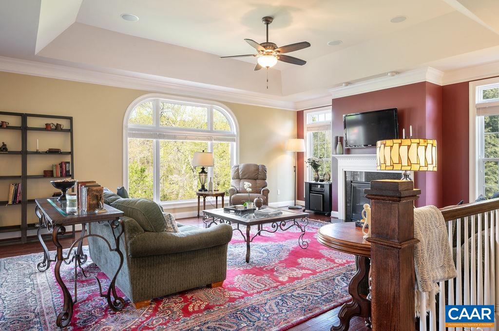 Large living room has hardwood floors. There are 10' ceilings throughout the main level.