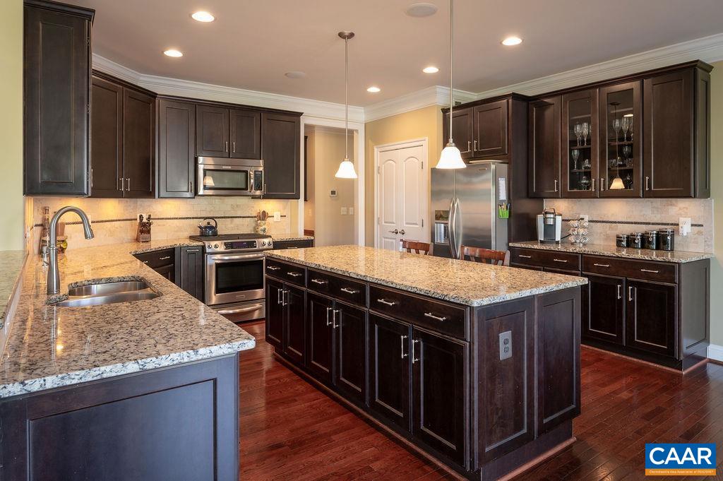 Kitchen island provides additional workspace.