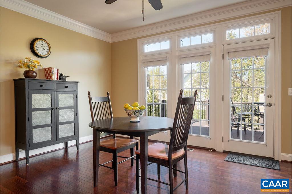 Breakfast room looks out to the meticulously maintained yard and gardens.