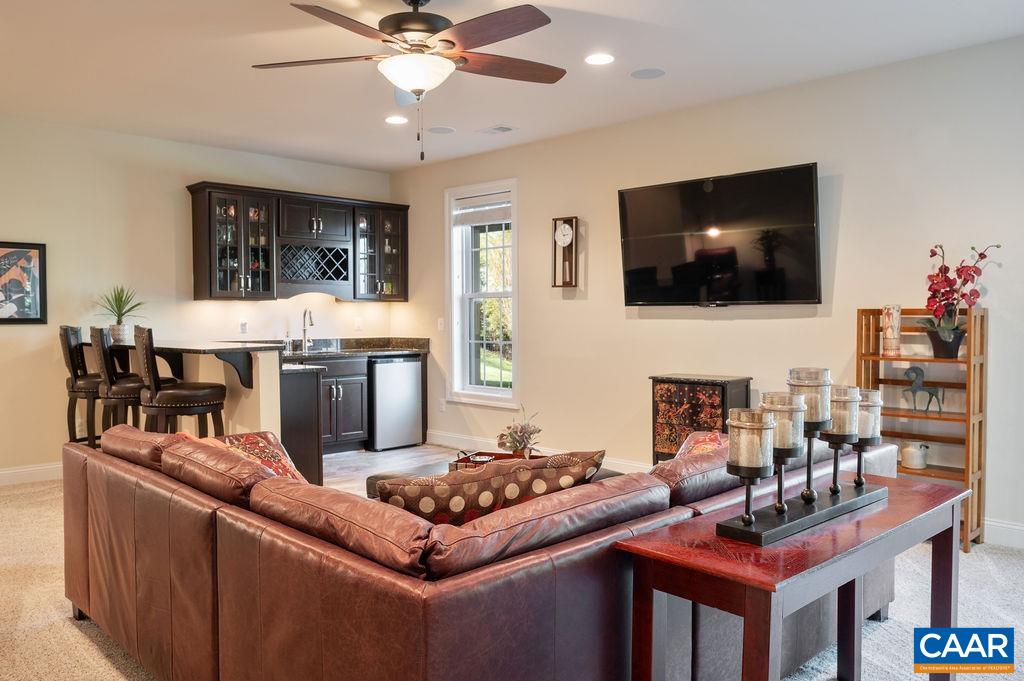 Large living area with wet bar on the lower level