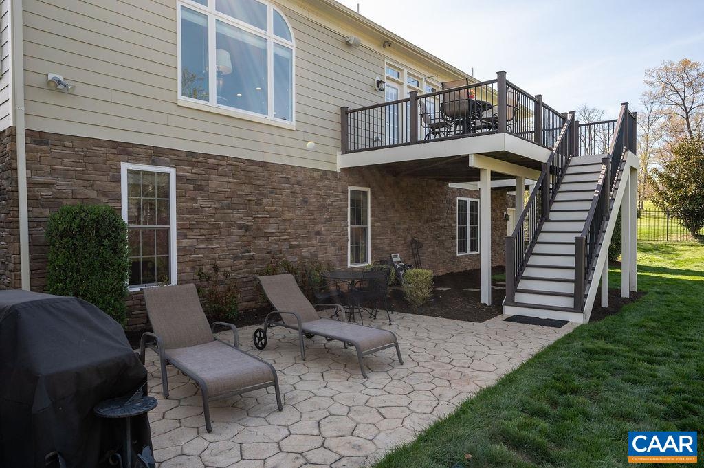There are steps from the patio to access the deck.