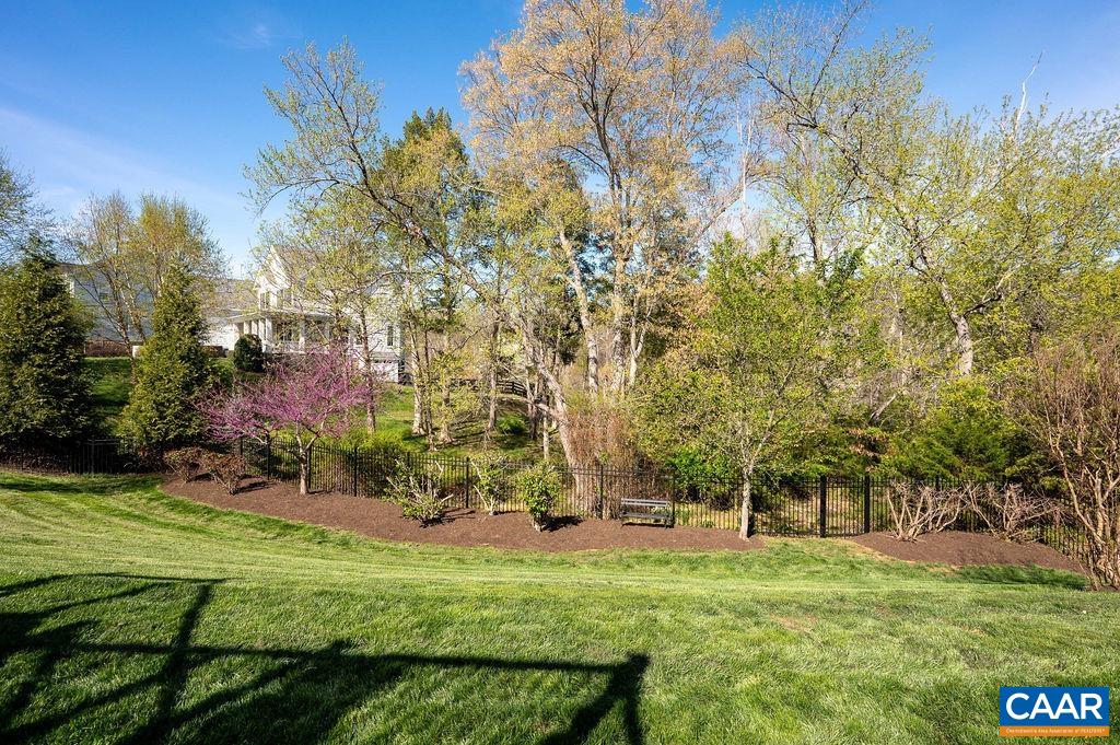The yard is beautifully landscaped and meticulously maintained by proud owners.